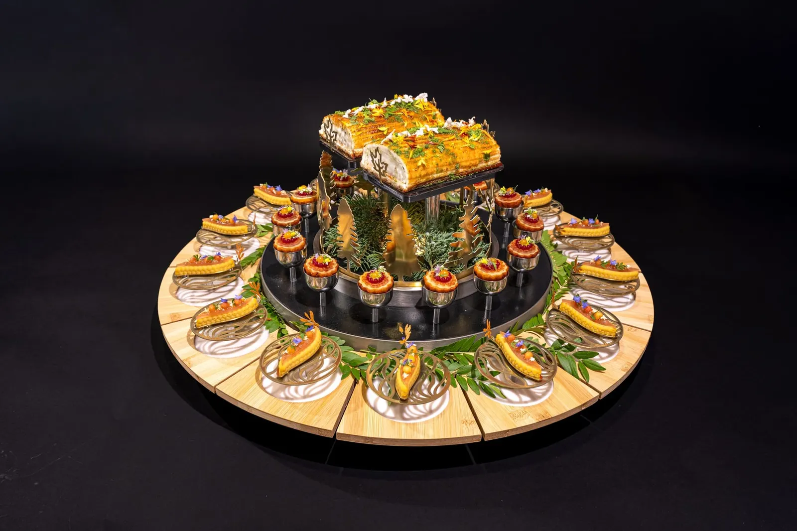 Team Canada's handcrafted presentation platter, ringed with individual garnished bites around a raised glazed centrepiece
