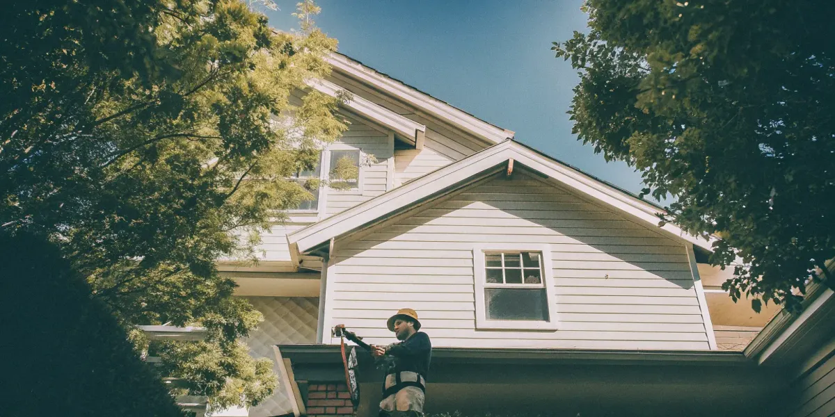 Home inspector examining a house's exterior for an inspection near me.