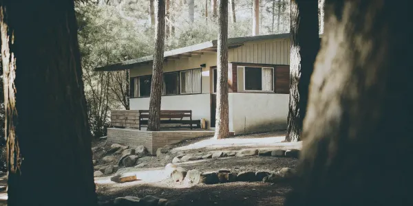 Modern home built with fire resistant materials and surrounded by defensible space.