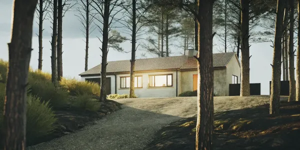 A home using wildfire mitigation techniques like a cleared defensible space.