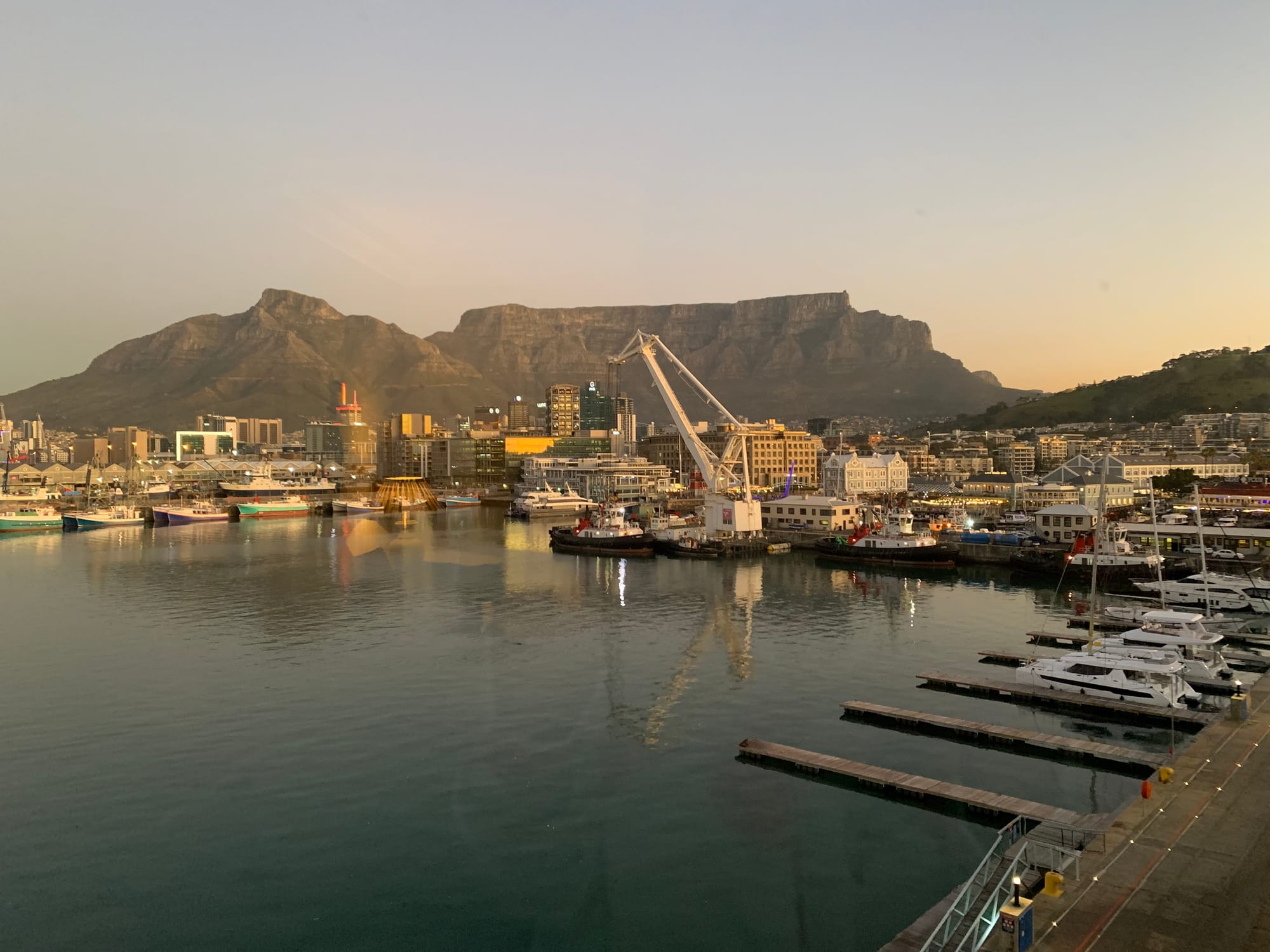 View from a mountain view room at the Table Bay Hotel at dusk with cape town harbour