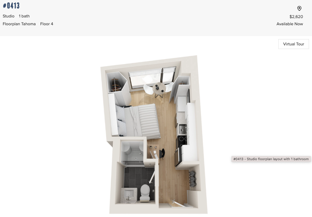 A $2,620/month micro unit advertised for rent at the 7Ink development in the South End shown from above with bed, kitchenette dining table and bathroom.