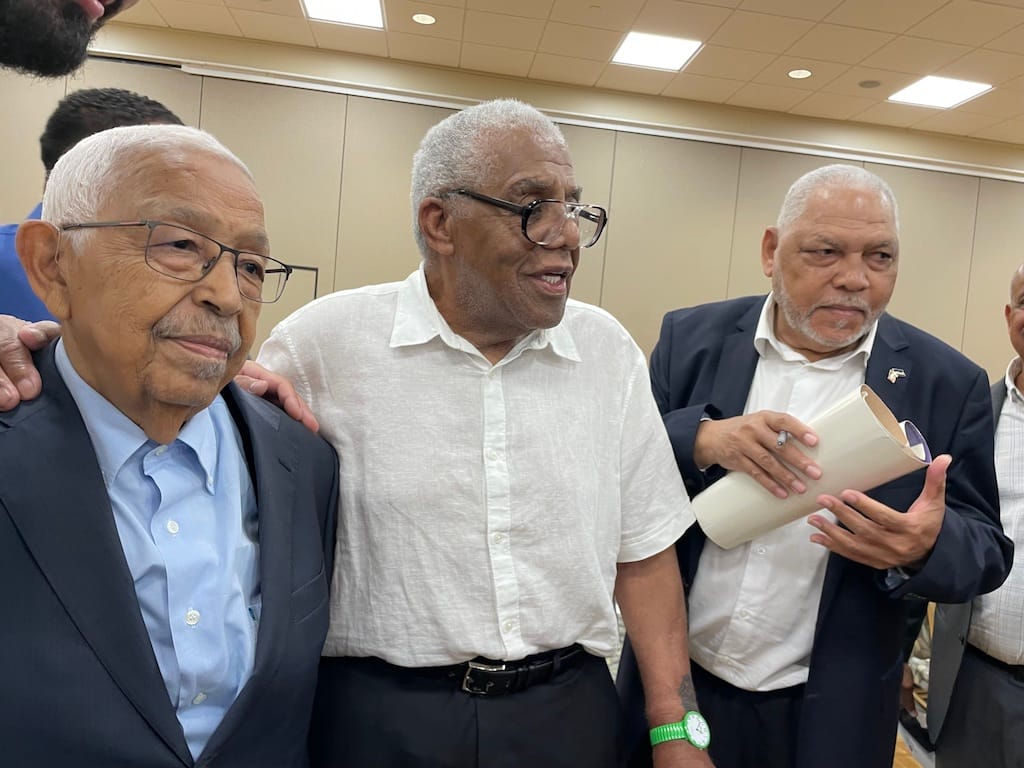 Pedro Pires, former PAIGCV soldier Tony Gonçalves, a PAICV activist Ulysses Gonçalves enjoy a moment following Pires' address.