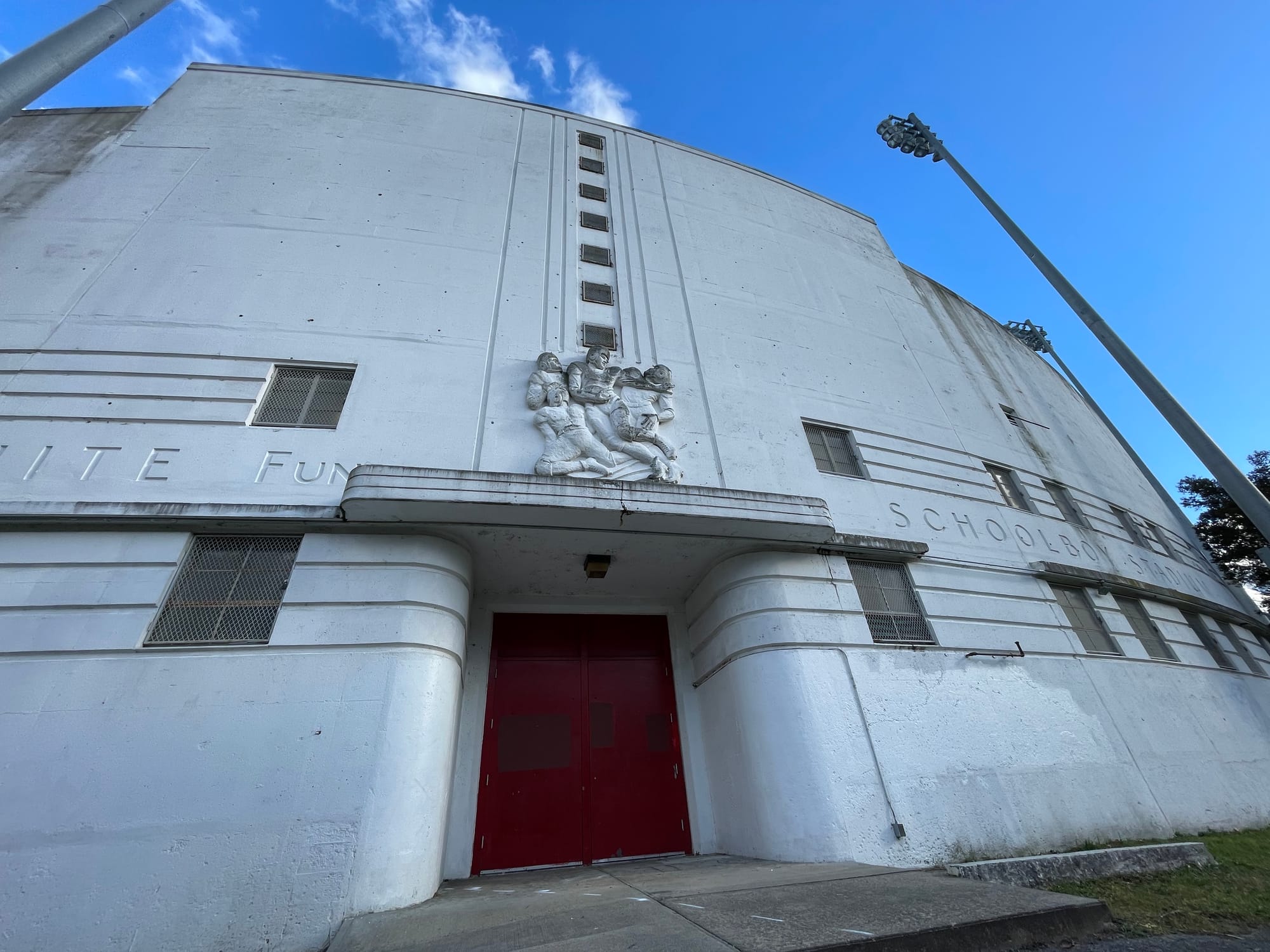 The exterior of the White Stadium western grandstand, prior to demolition, showing a bass relief of football players.