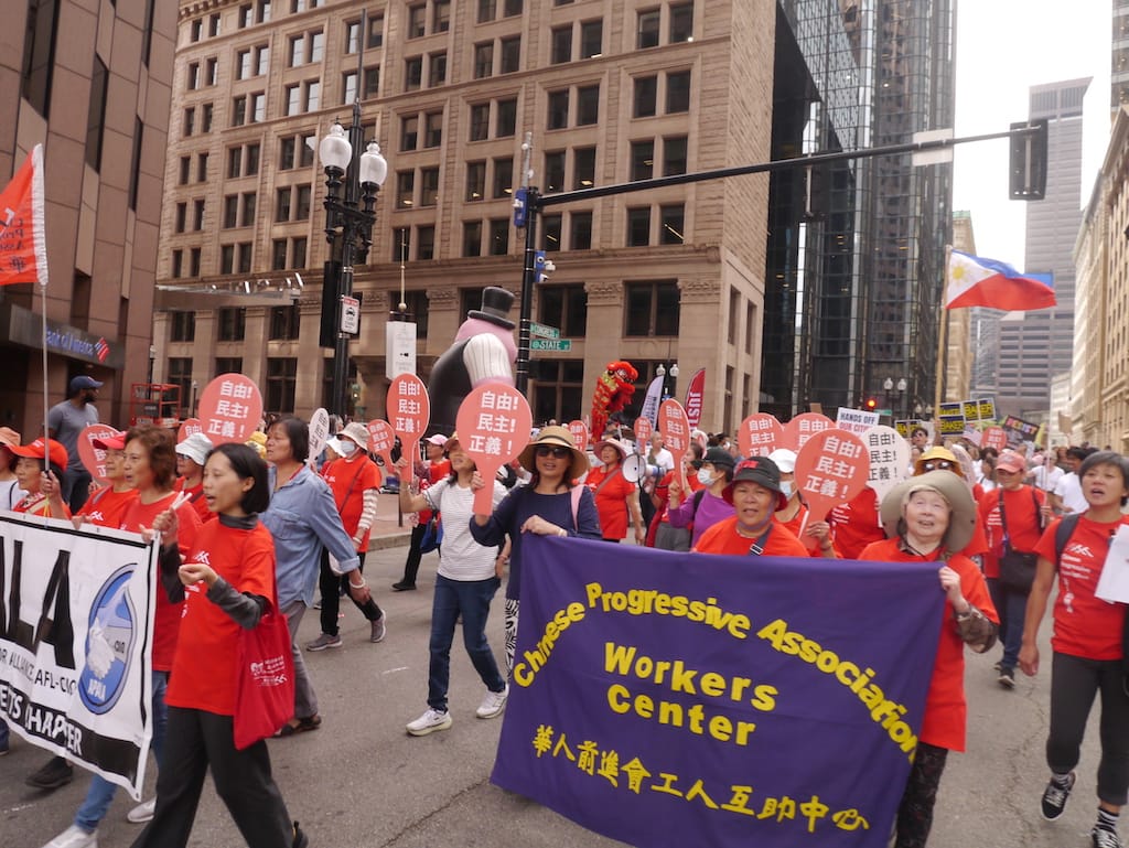 Members of the Asian Pacific Islander Workers Alliance and Chinese Progressive Association march on Congress Street.