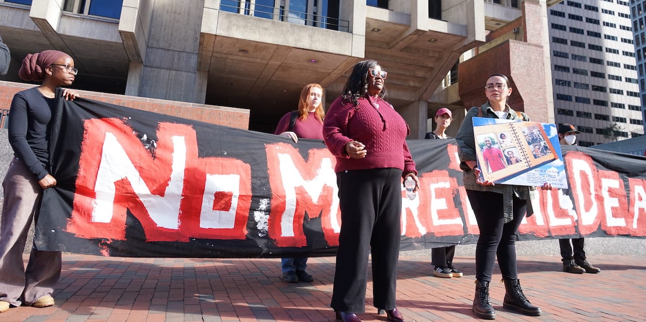 Druesilla Brown, mother of Shacoby Kenny, who was killed by guards in the South Bay House of Correction, speaks to reporters outside City Hall accompanied by activistis.