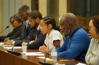 Seated with other community members, Franklin Park abutter Priscilla Andrade testifies during a City Council hearing on the leasing of White Stadium to a women’s professional soccer team. 