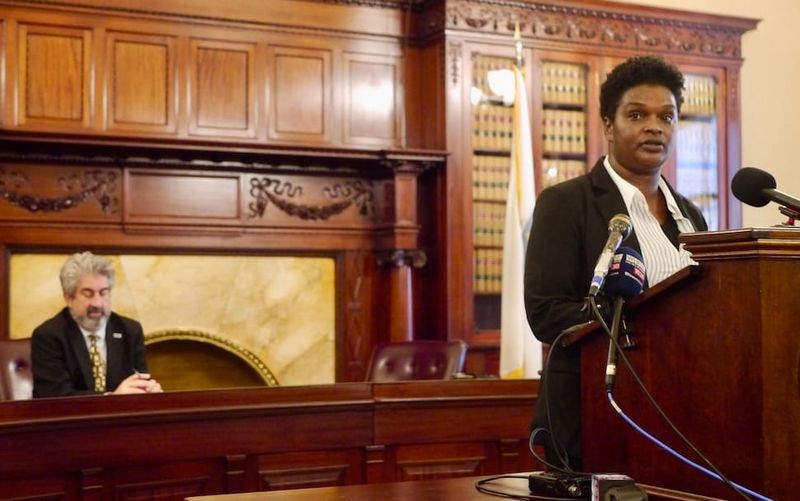 Education activist Suleika Soto addresses reporters during a press conference at the State House.
