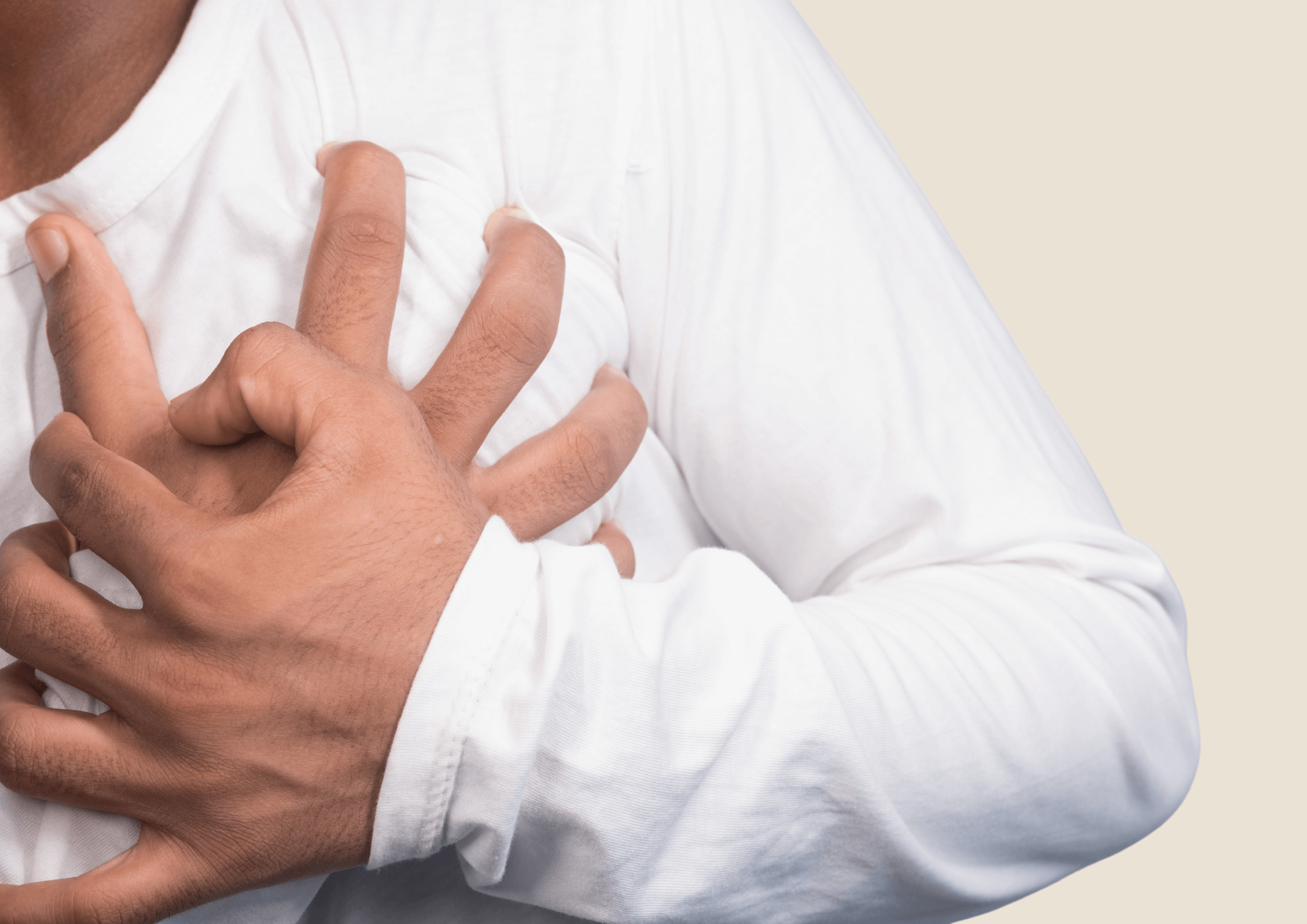 Man holds on to his aching chest.