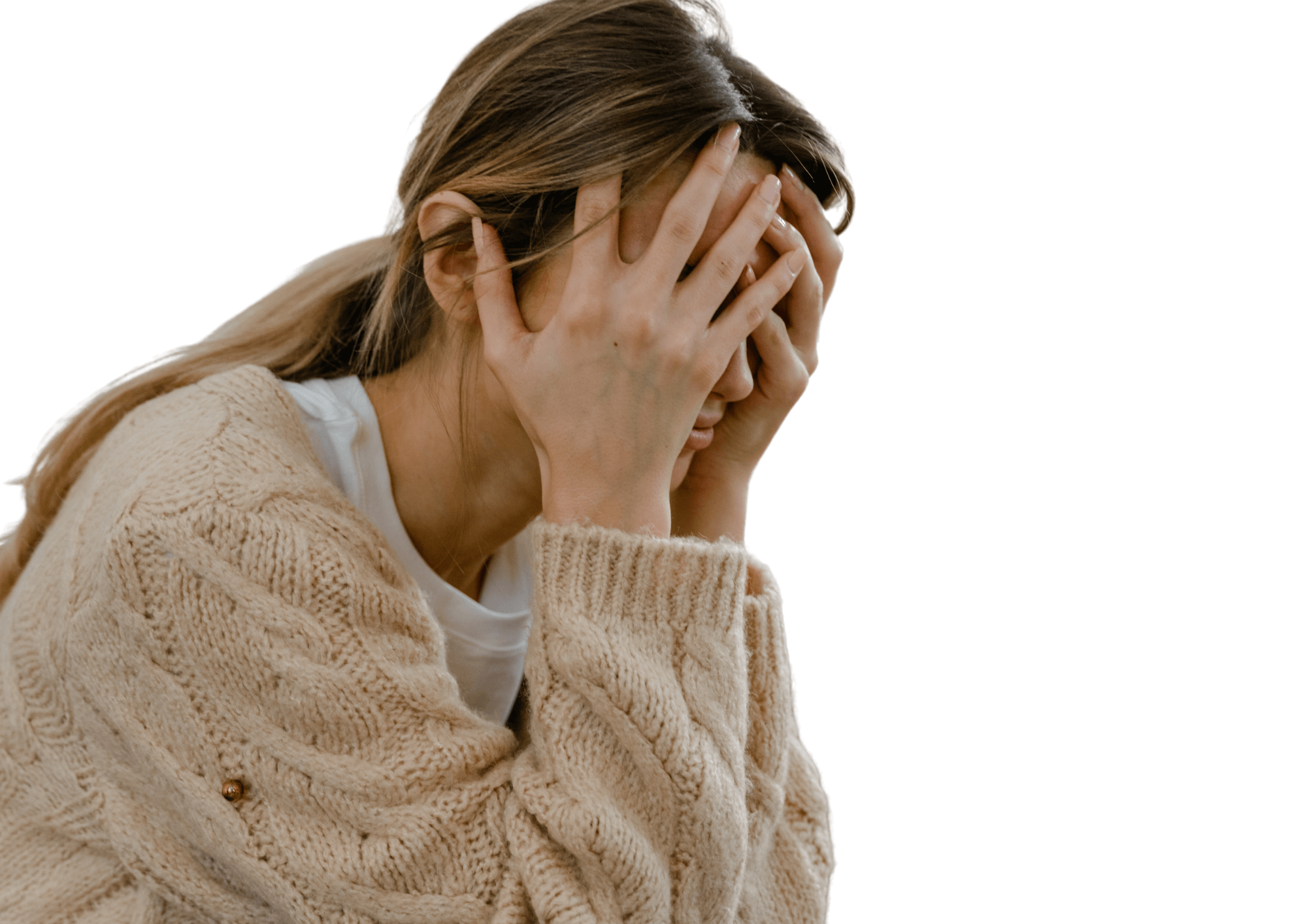 Stressed woman rests her face on her hands.