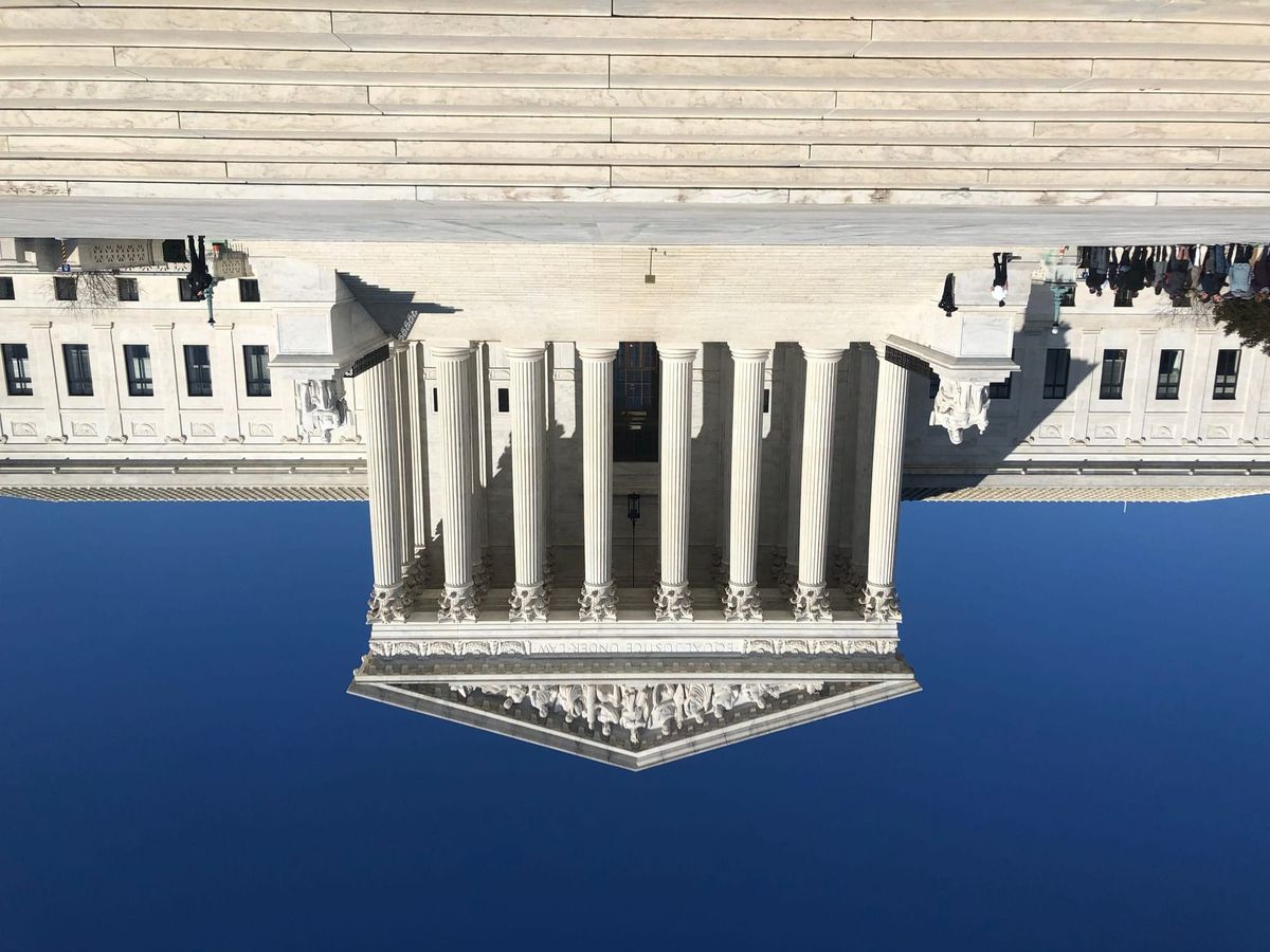 The Supreme Court building in Washington DC, but flipped upside down. Photo credit Marielam1 