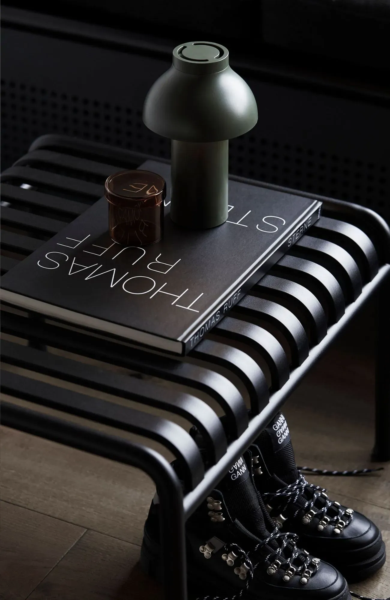 Cedar Cabin by Nicholas Gurney & Monique Easton. Styled coffee table book on black stool.