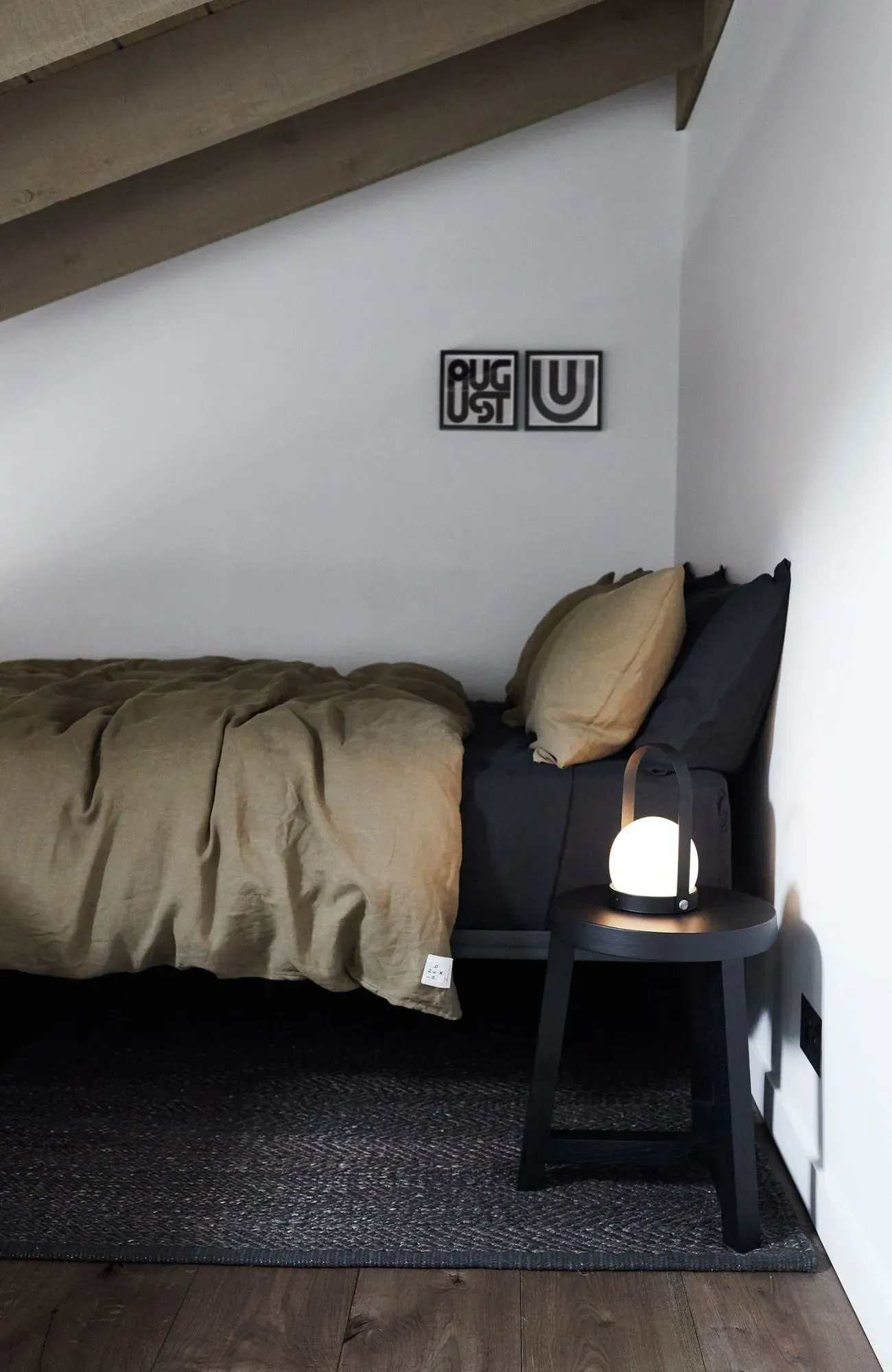 Cedar Cabin by Nicholas Gurney & Monique Easton. Cosy loft bed, styled with side stool and lamp.