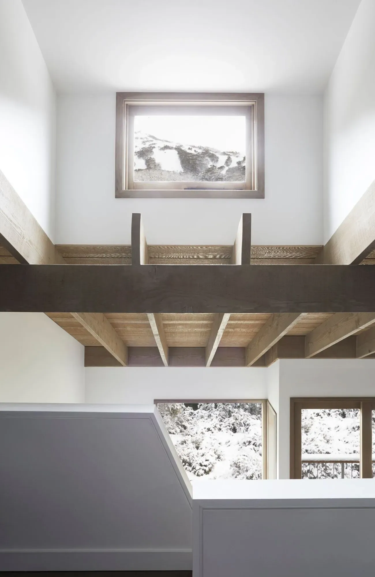 Cedar Cabin by Nicholas Gurney & Monique Easton. Interior view of raised loft & windows.