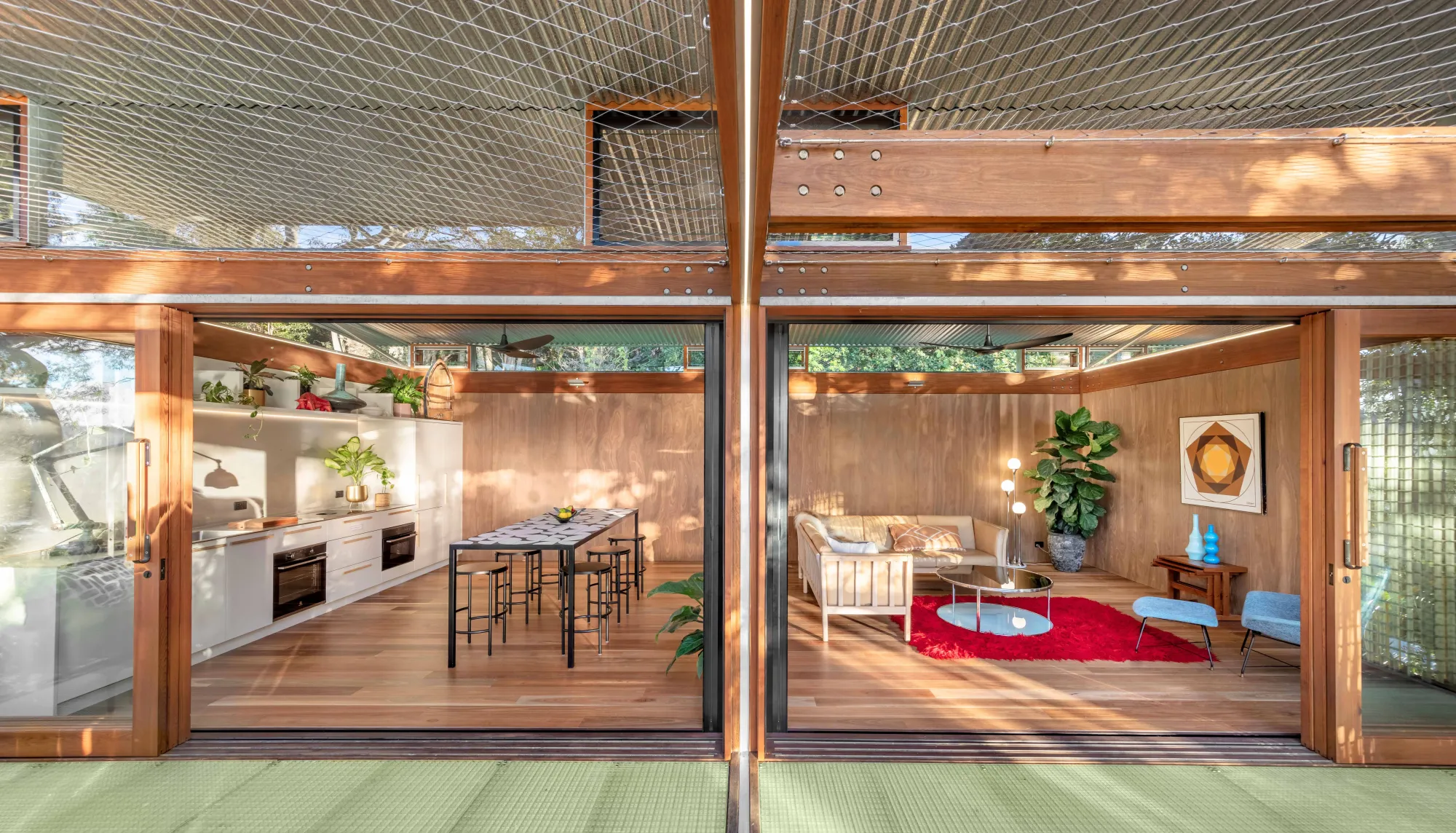 Balmy Palmy by CplusC Architectural Workshop. View from decking into kitchen (left) and living room (right)