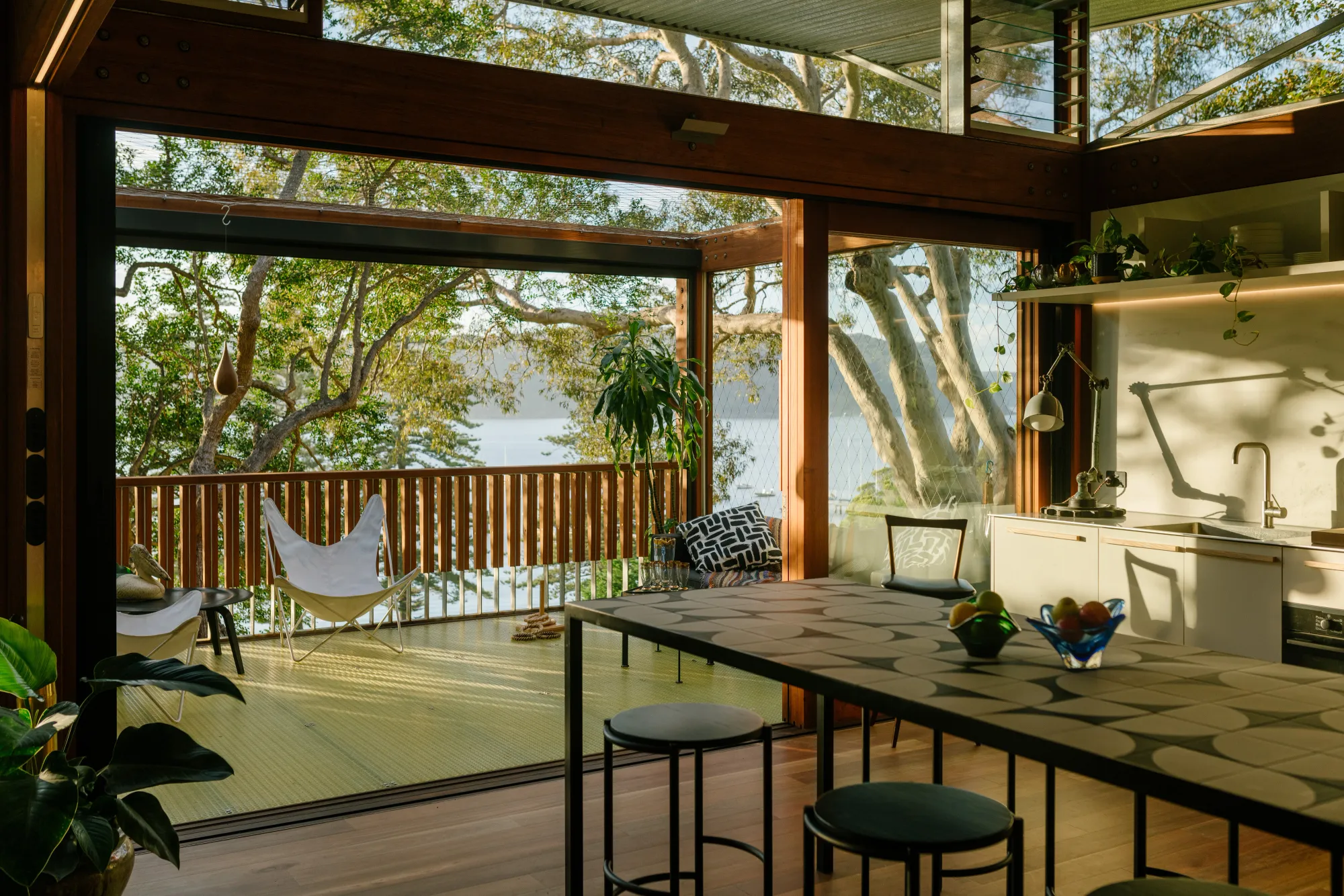 Balmy Palmy by CplusC Architectural Workshop. view from kitchen out to deck and surrounding palm beach views 