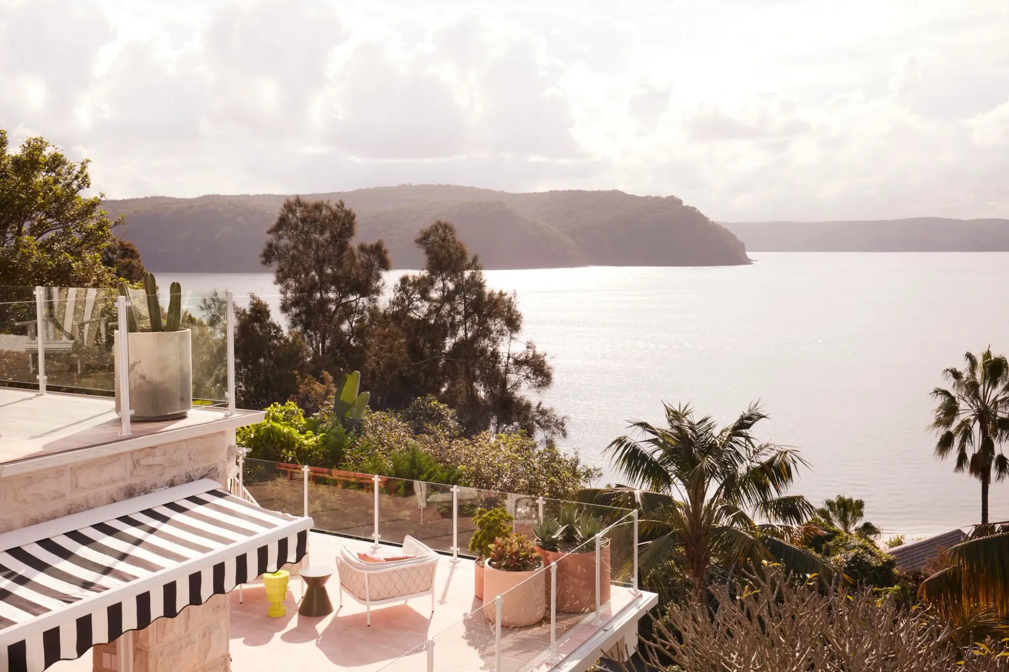 La Palma by YSG Studio. Birds eye view of tiered outdoor balcony out to Sydney's Northern Beaches. 