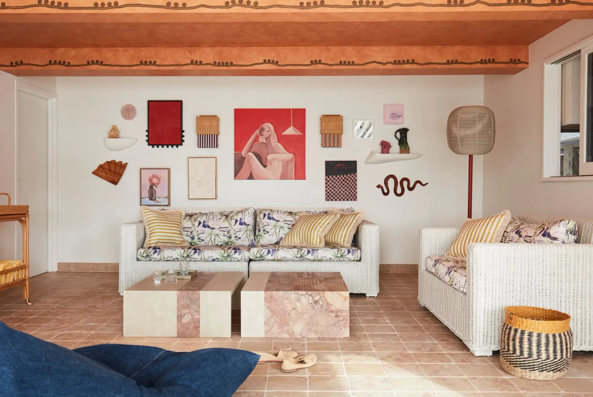 La Palma by YSG Studio. Living room styled with an abundance of abstract paintings and decor.