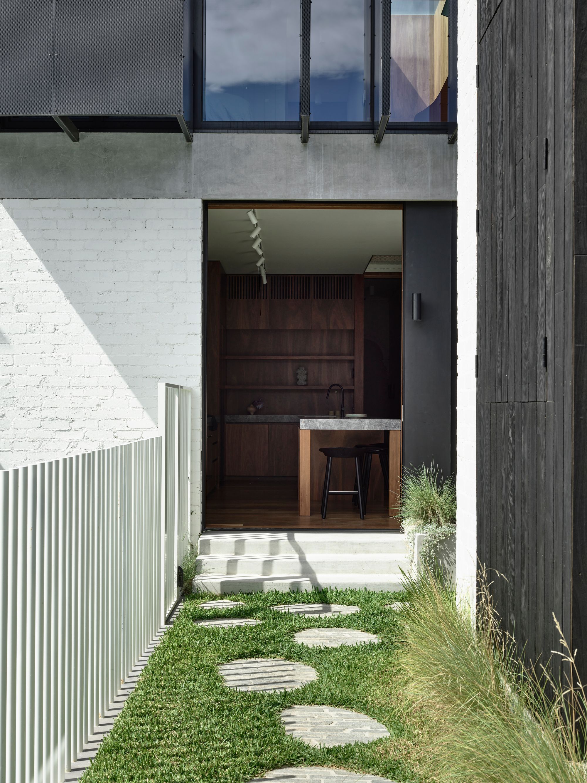 Carlton North Residence by Project 12 Architecture. Backyard view of new extension