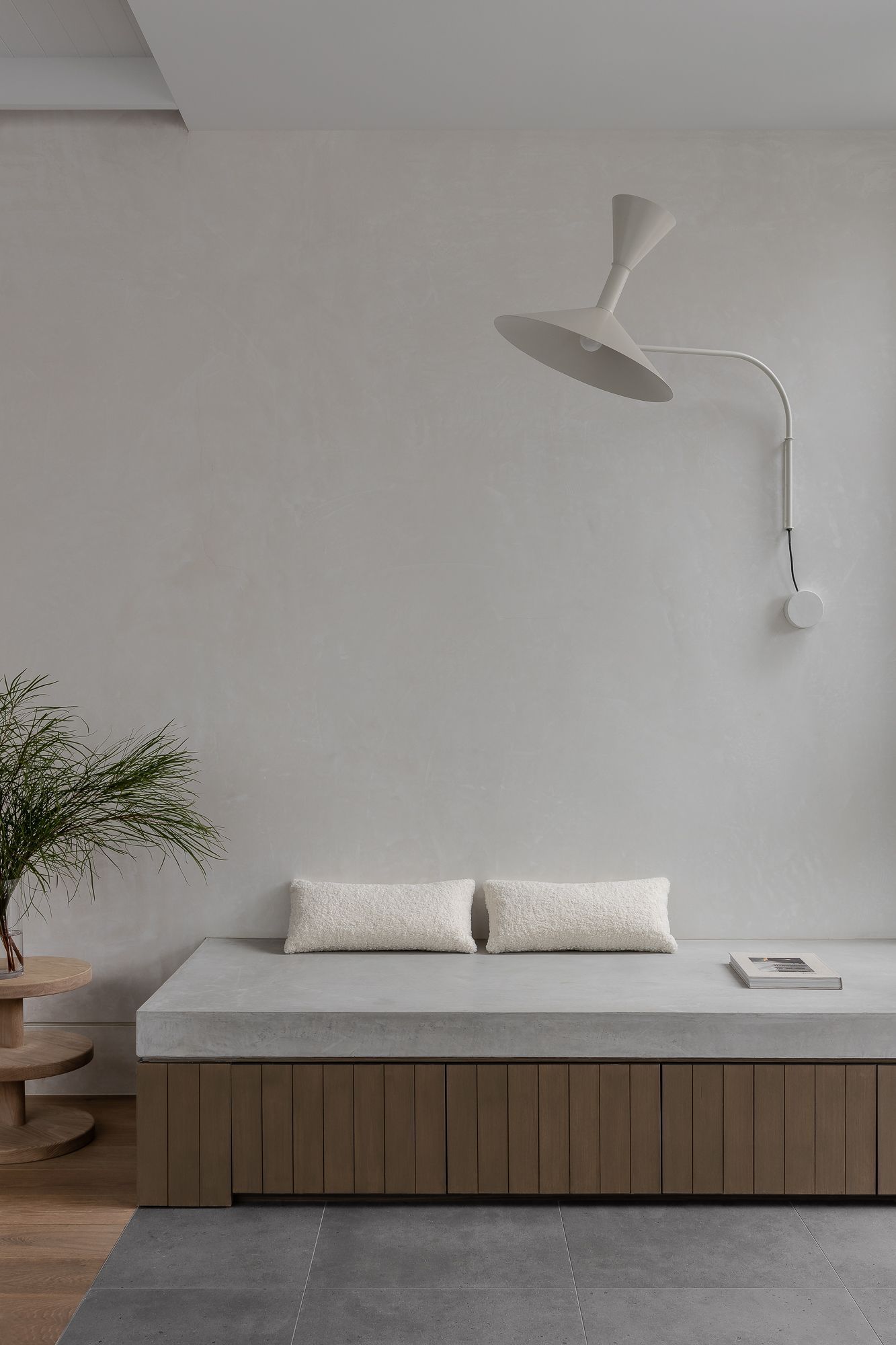 Ripponlea House by Luke Fry Architecture and Interior Design. Featuring custom concrete and European oak seating, styled with boucle cushions