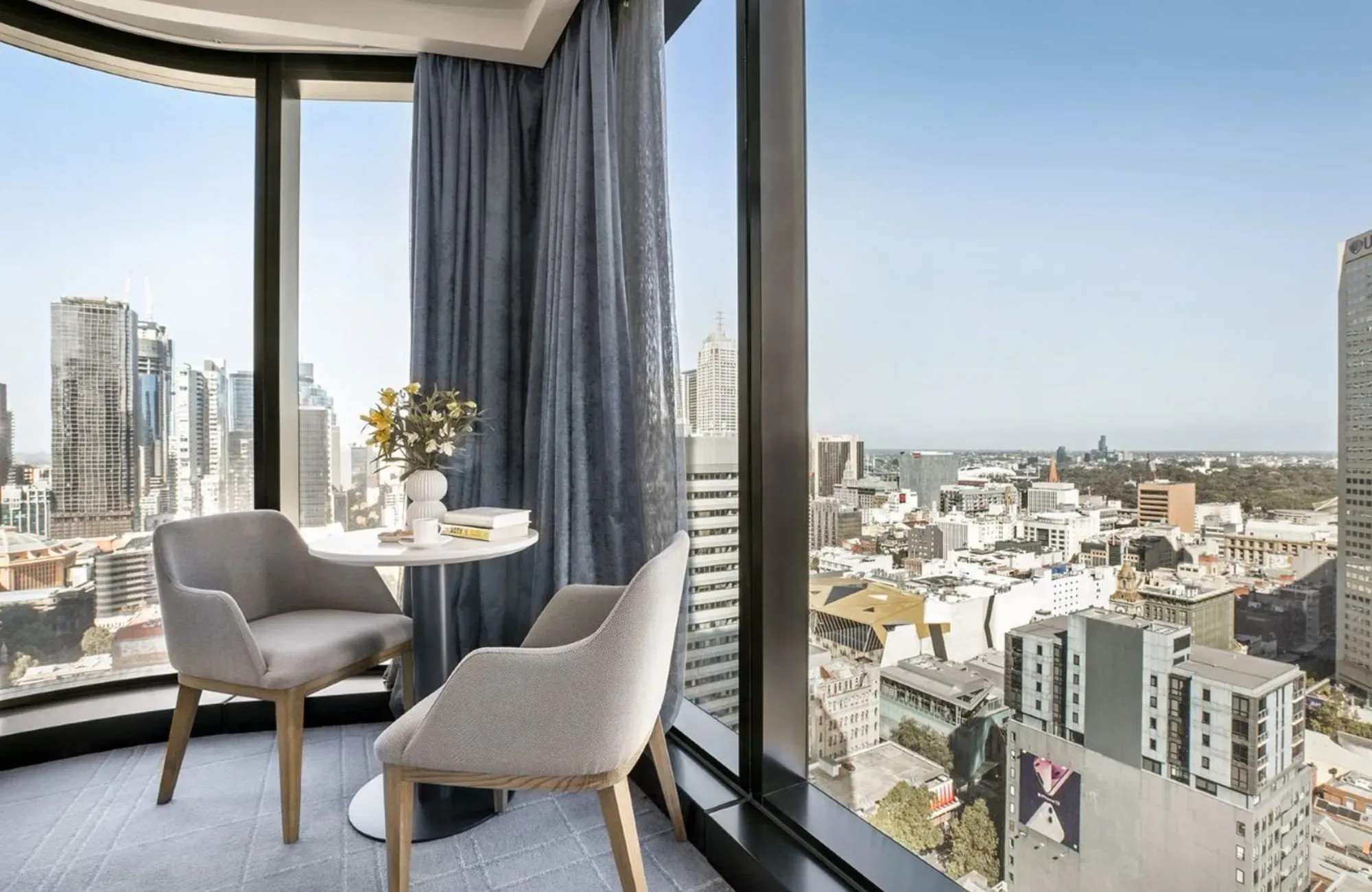 Voco Melbourne Central by IHG Hotels & Resorts. Guests room, casual dining seating corner