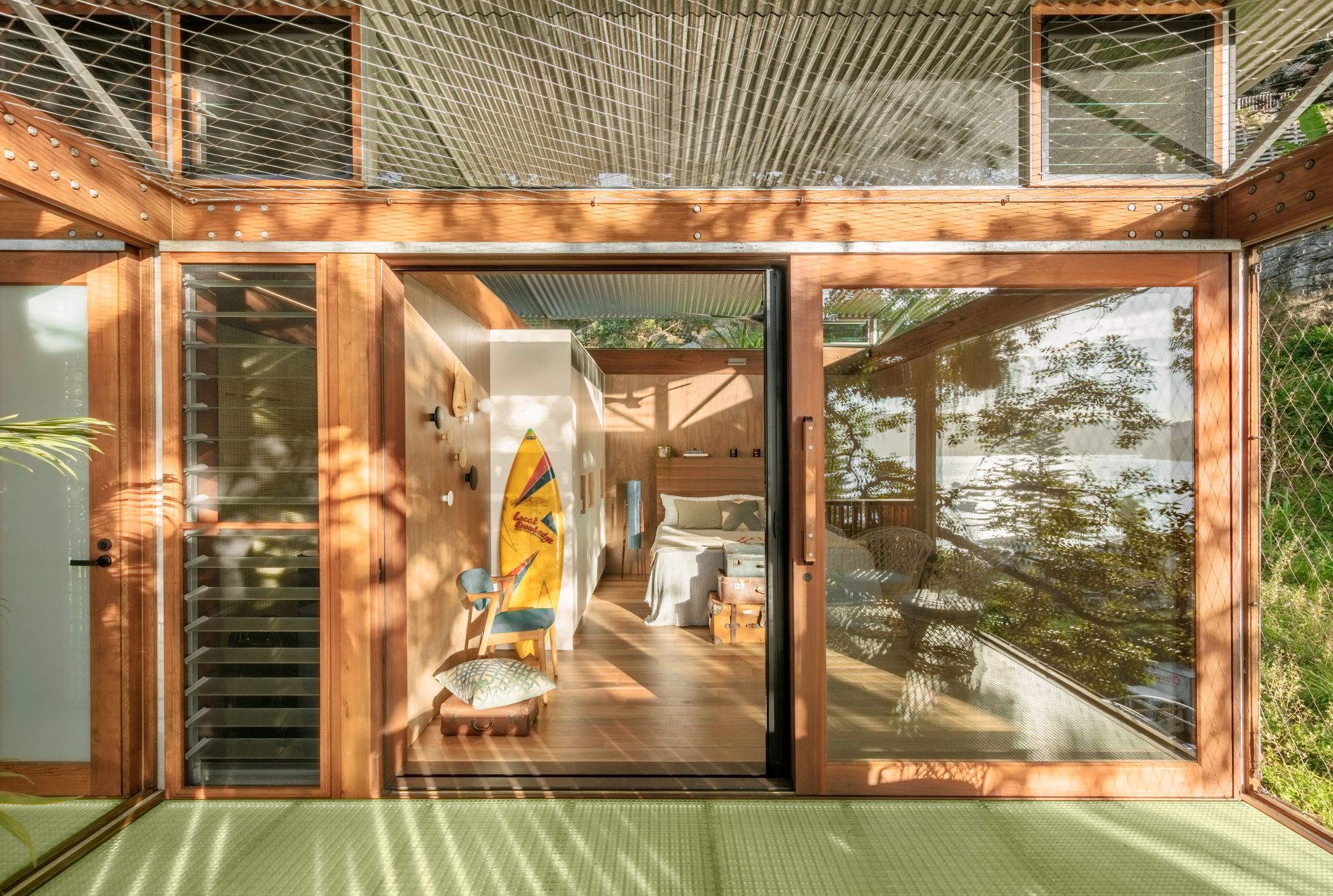 Balmy Palmy by CplusC Architectural Workshop. View from decking into main bedroom