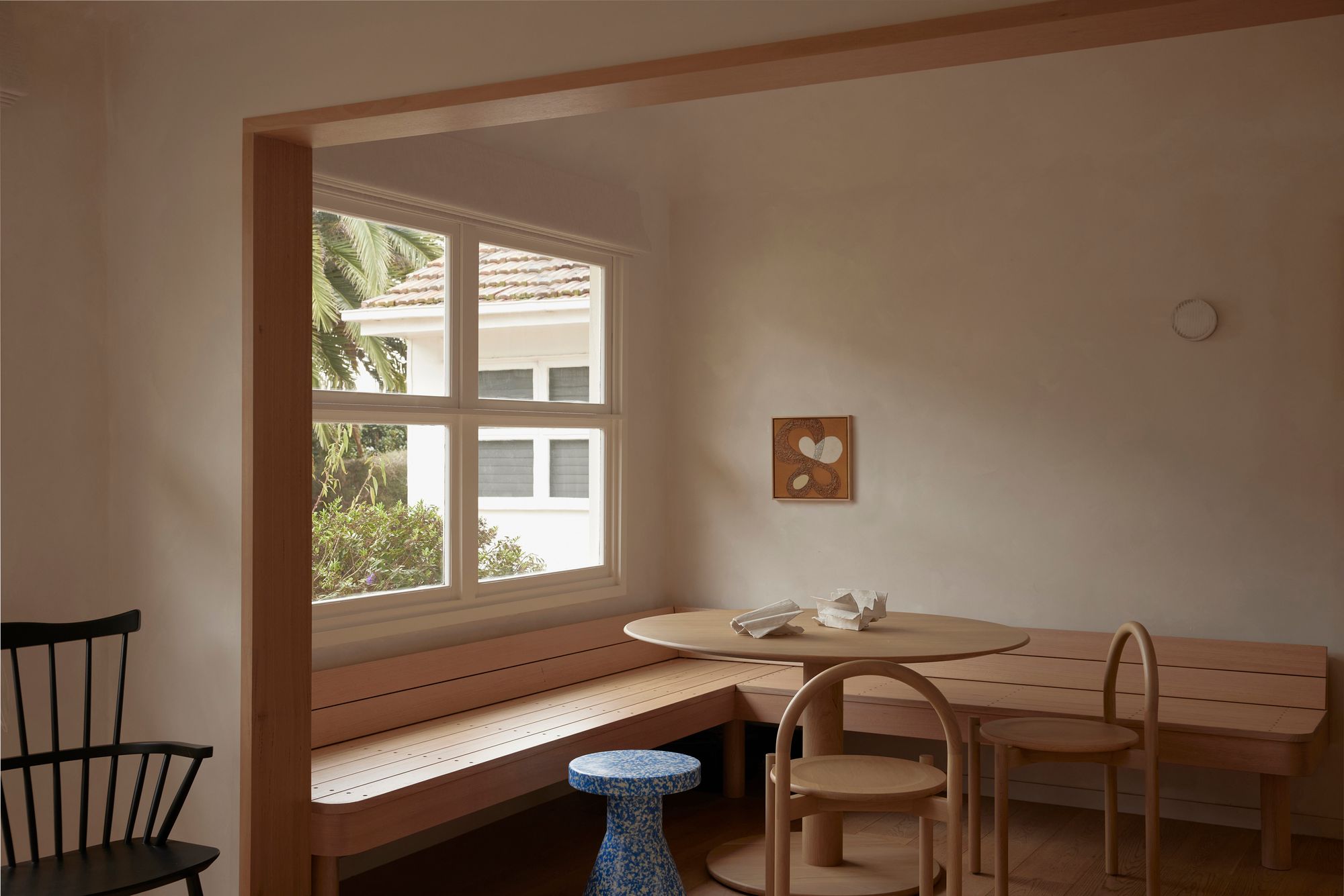 Portsea Surf Shack by Blair Smith Architecture. Dining room featuring booth seating with soft timber accents. 