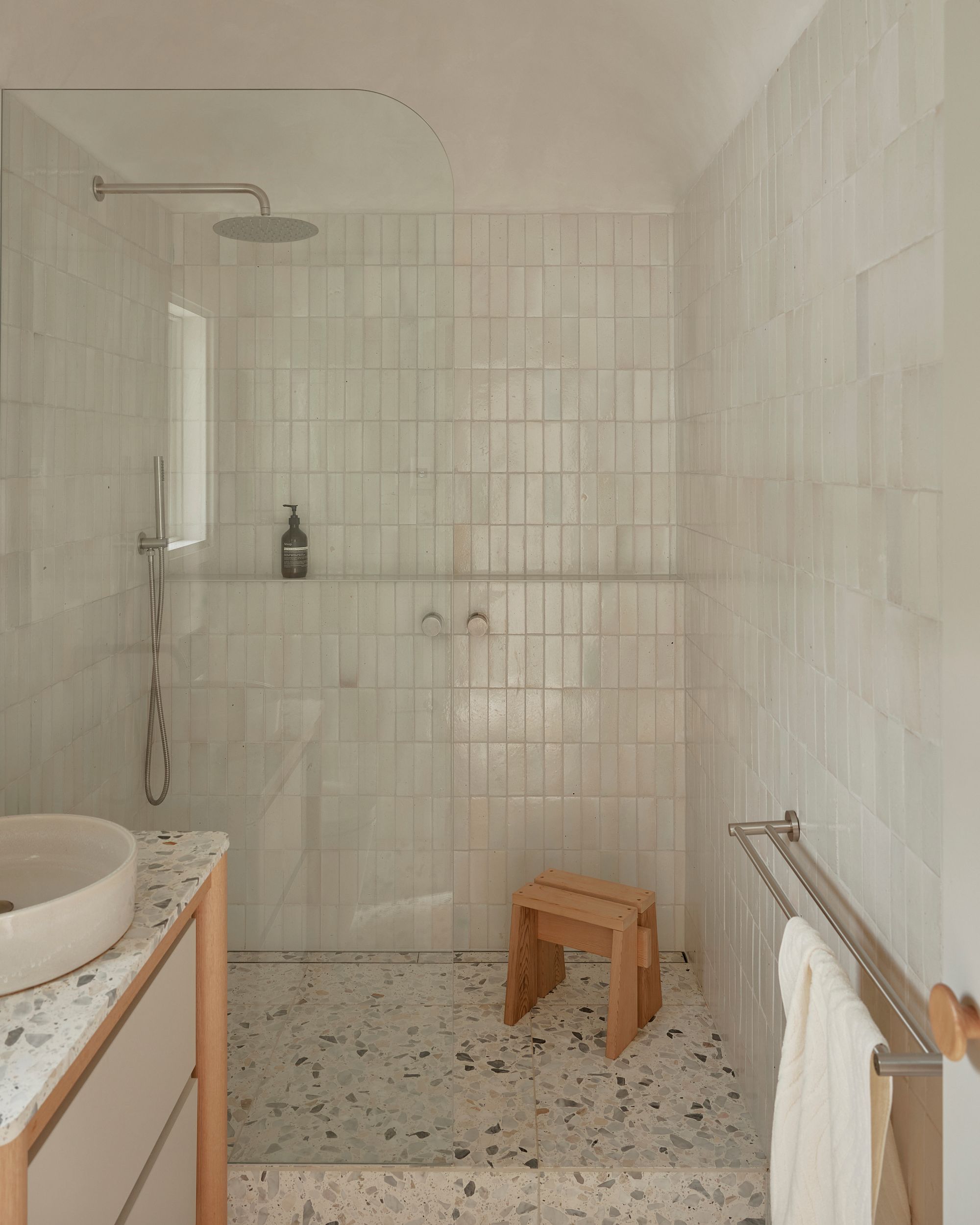 Portsea Surf Shack by Blair Smith Architecture. View of bathroom, with step up into shower. 