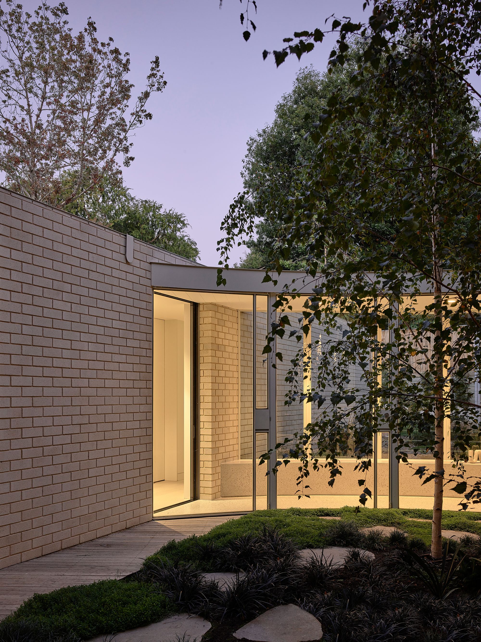 Brimar House by Michael Ong Design Office. View of first floor passage form outdoors. 