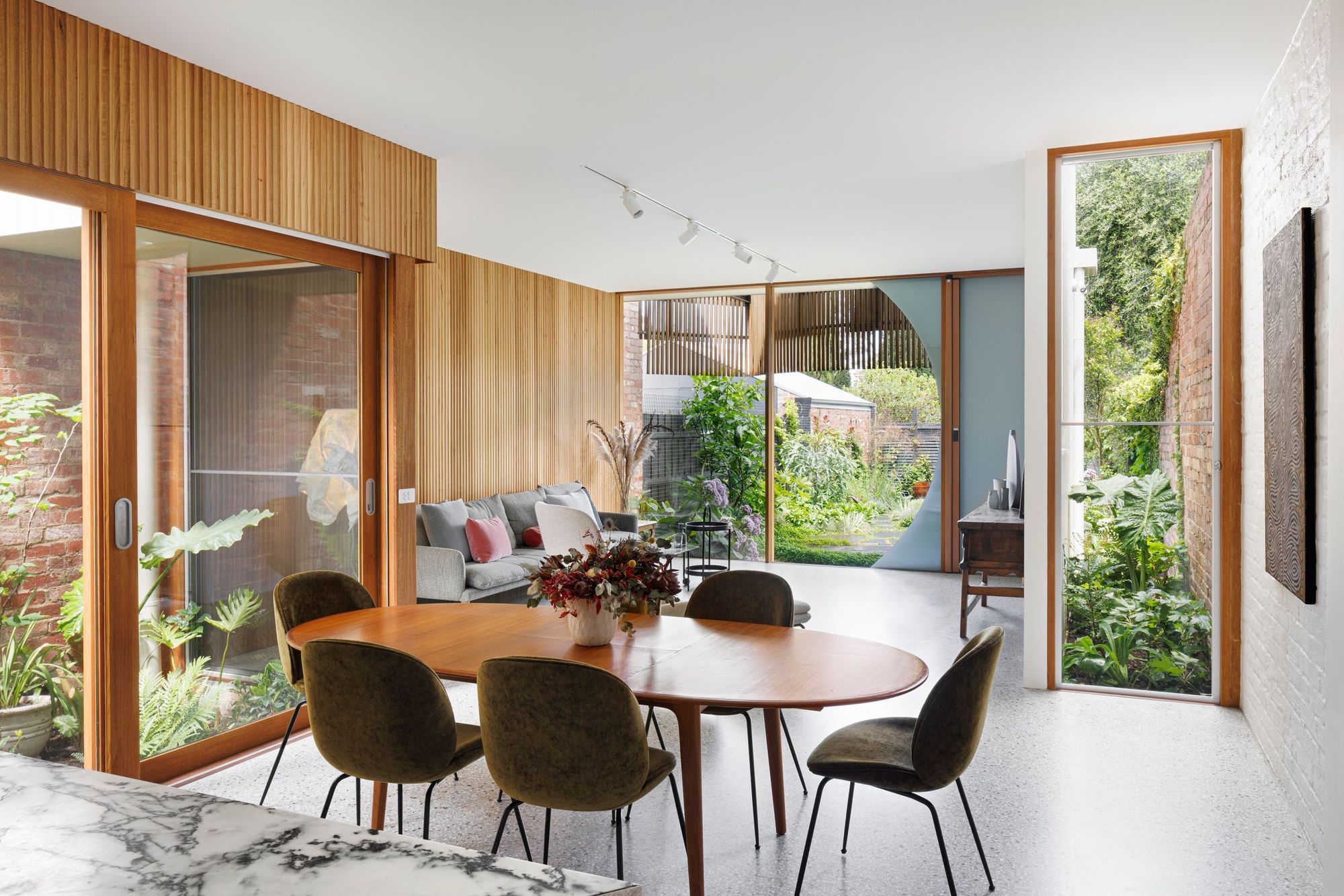 Tiara House by FMD Architects. Dining and living room view from kitchen