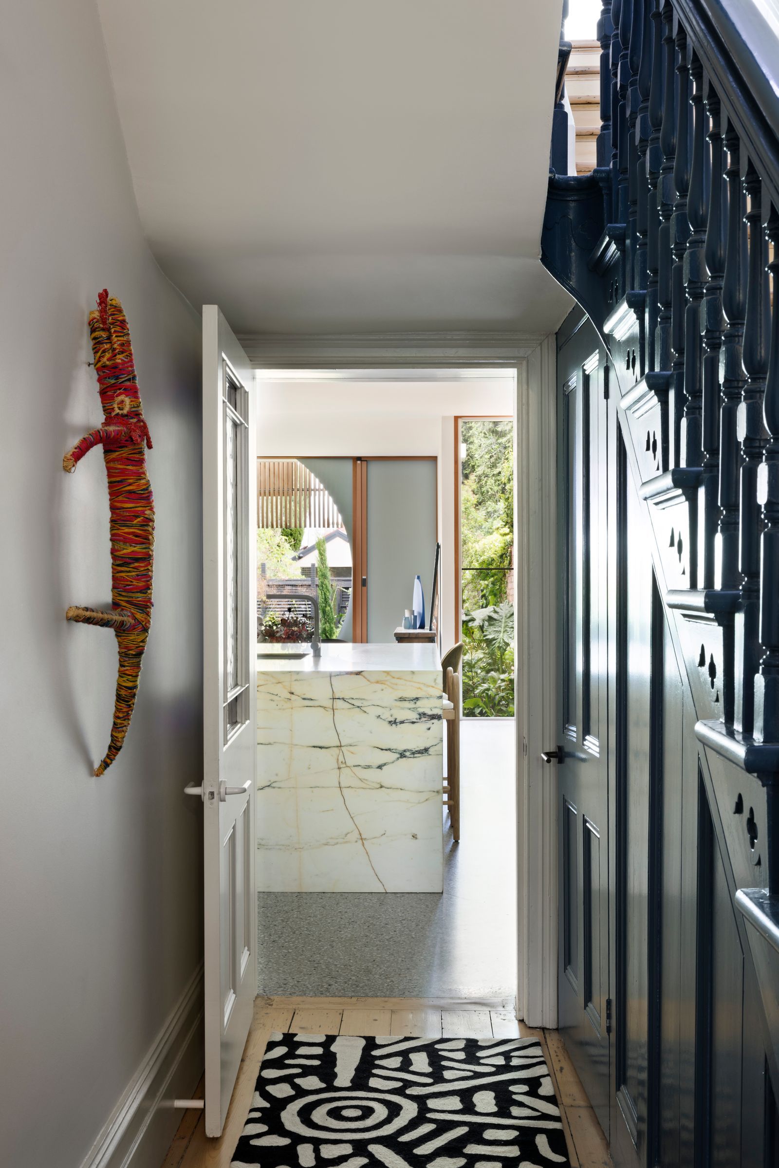 Tiara House by FMD Architects. View transitioning from entrance to new exterior extension