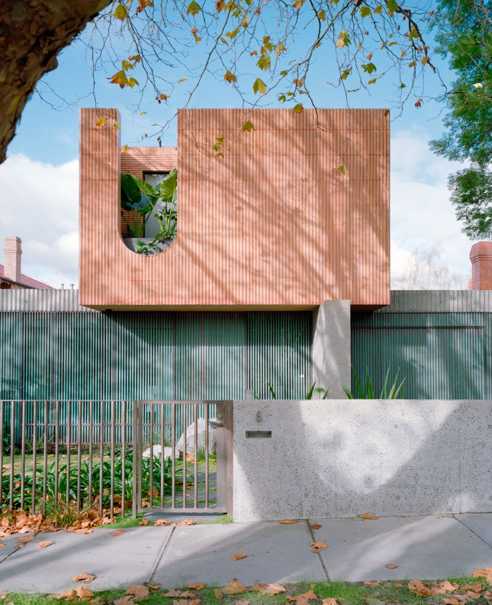 Glen Iris House by&nbsp;Pandolfini Architects. Front façade of house pictured, subtle tones of salmon and tea.