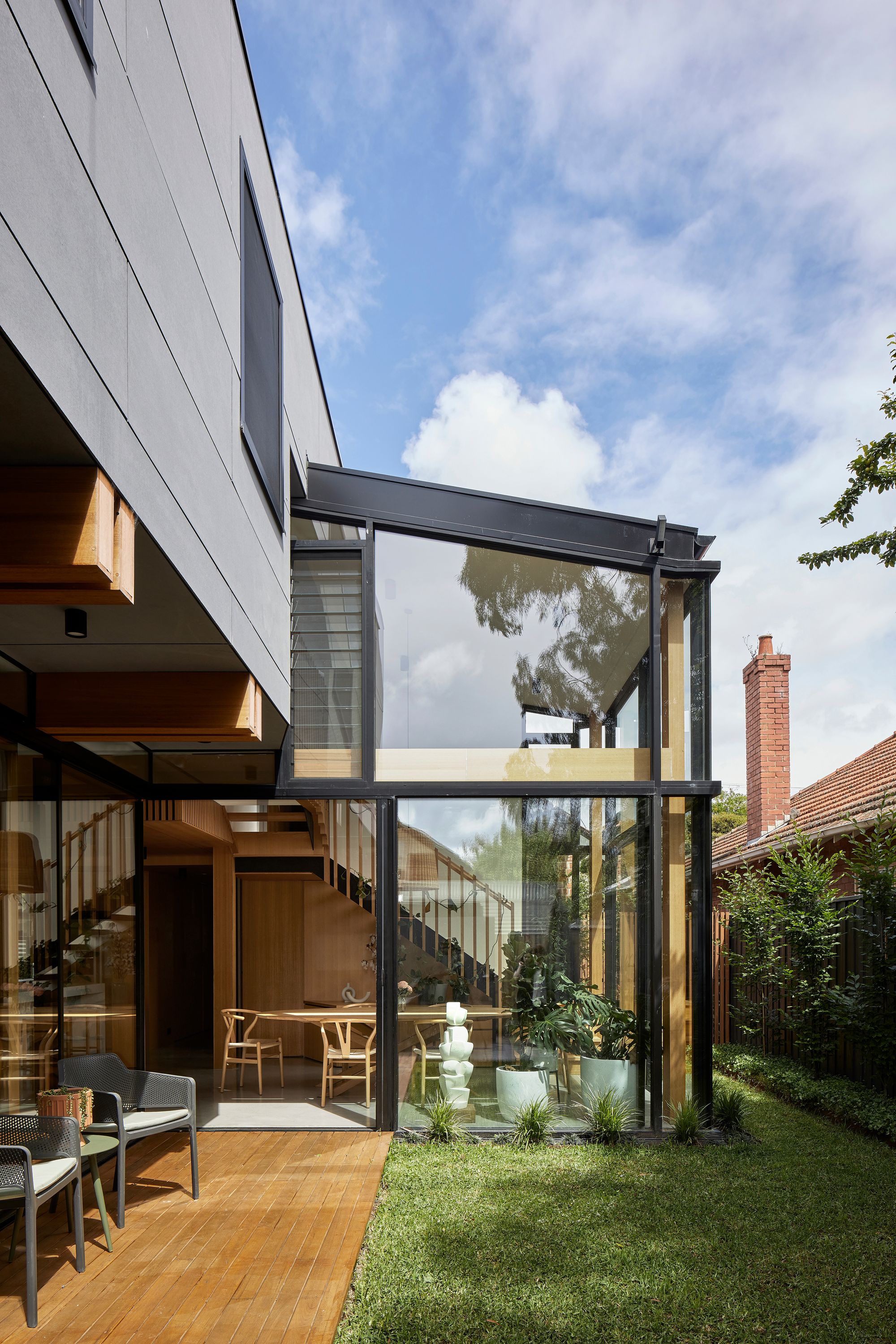 Timber Lantern House by mcmahon and nerlich. Garden view of rear extension, cantilevered level 