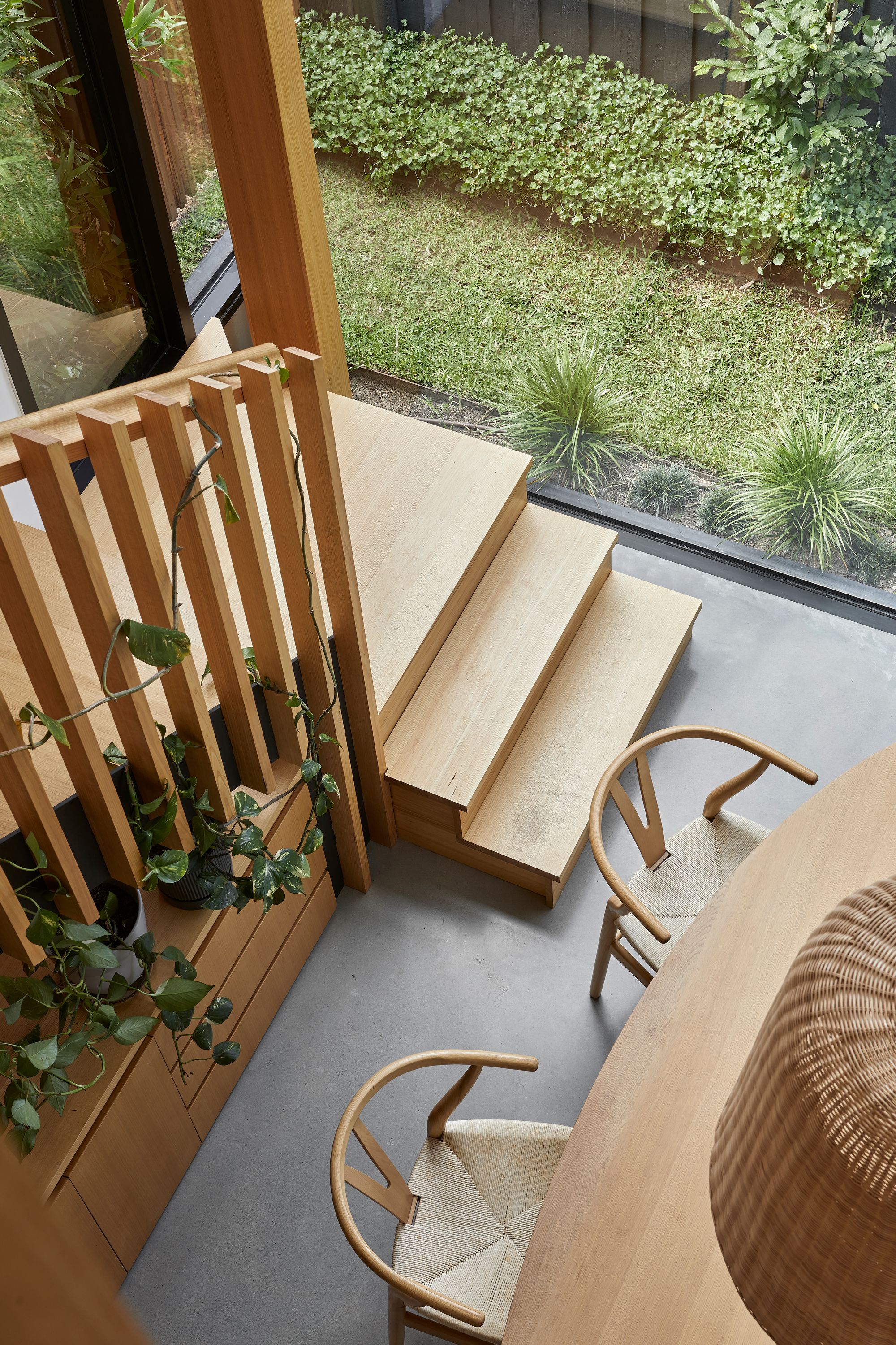 Timber Lantern House by mcmahon and nerlich. Birds eye view from second level down to first floor. 