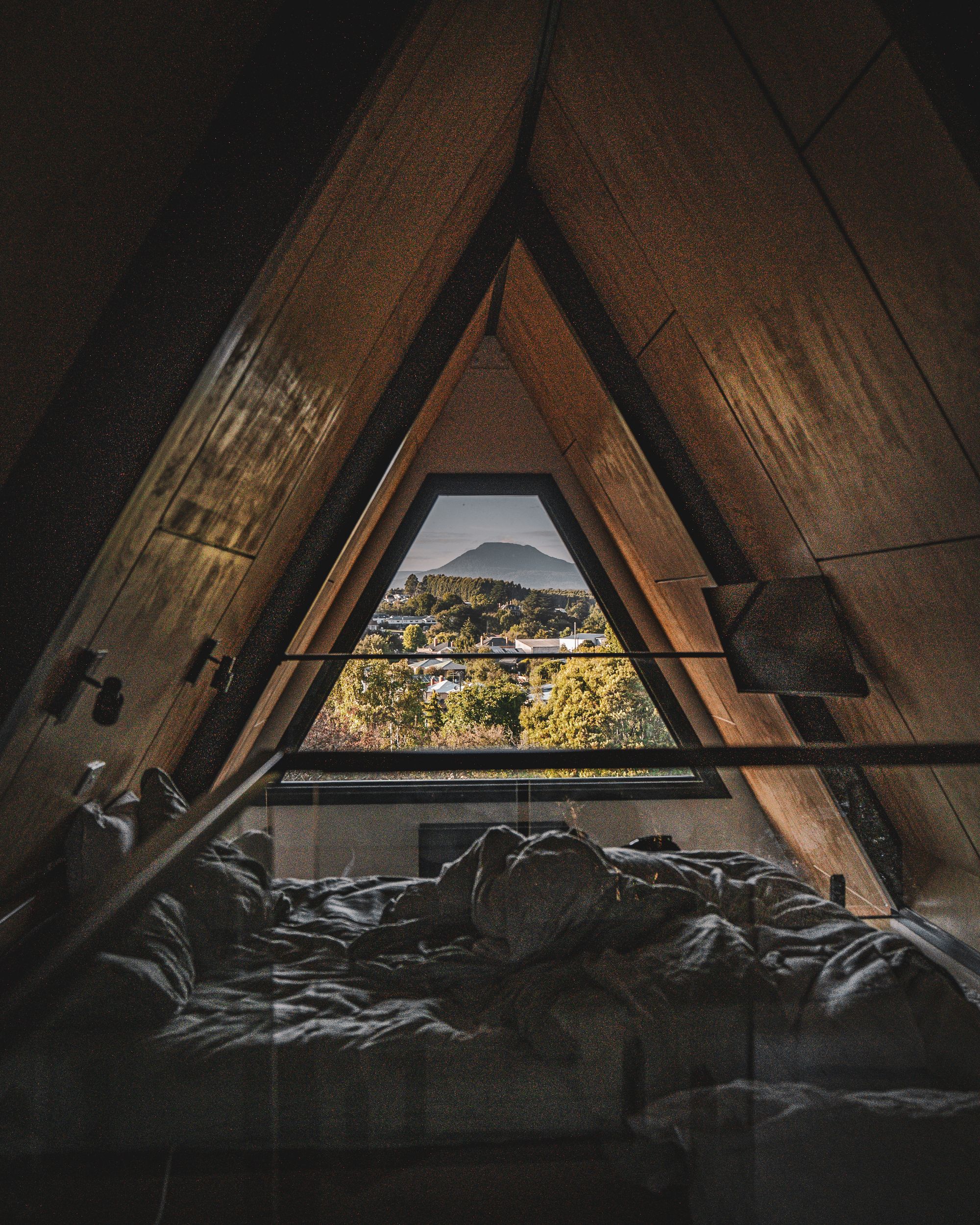 The Eco Cabin Tasmania by Wild Life Environmental. Loft view out to surrounding landscape.