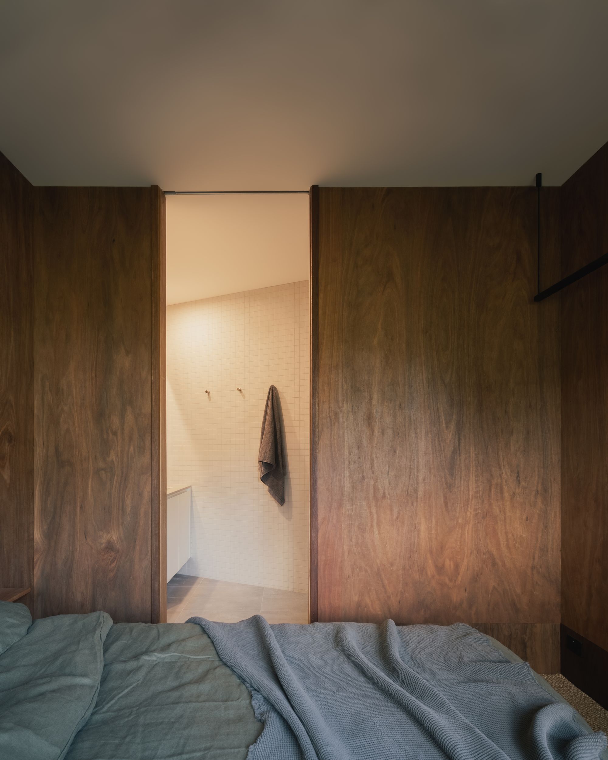 Kennett River House by MGAO showing ensuite in main bedroom
