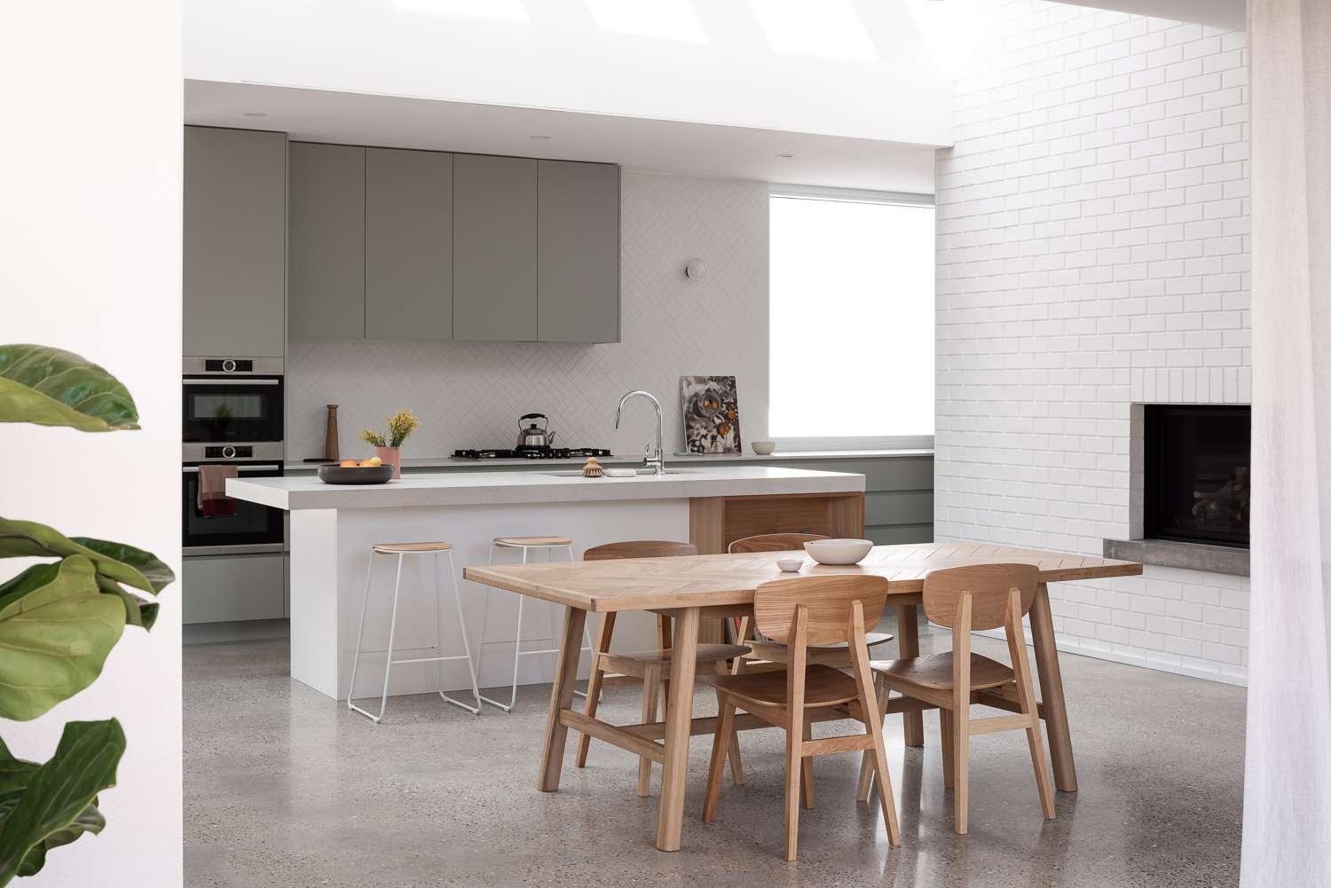 The Third by Dalecki Design showing interior of dining and kitchen spaces