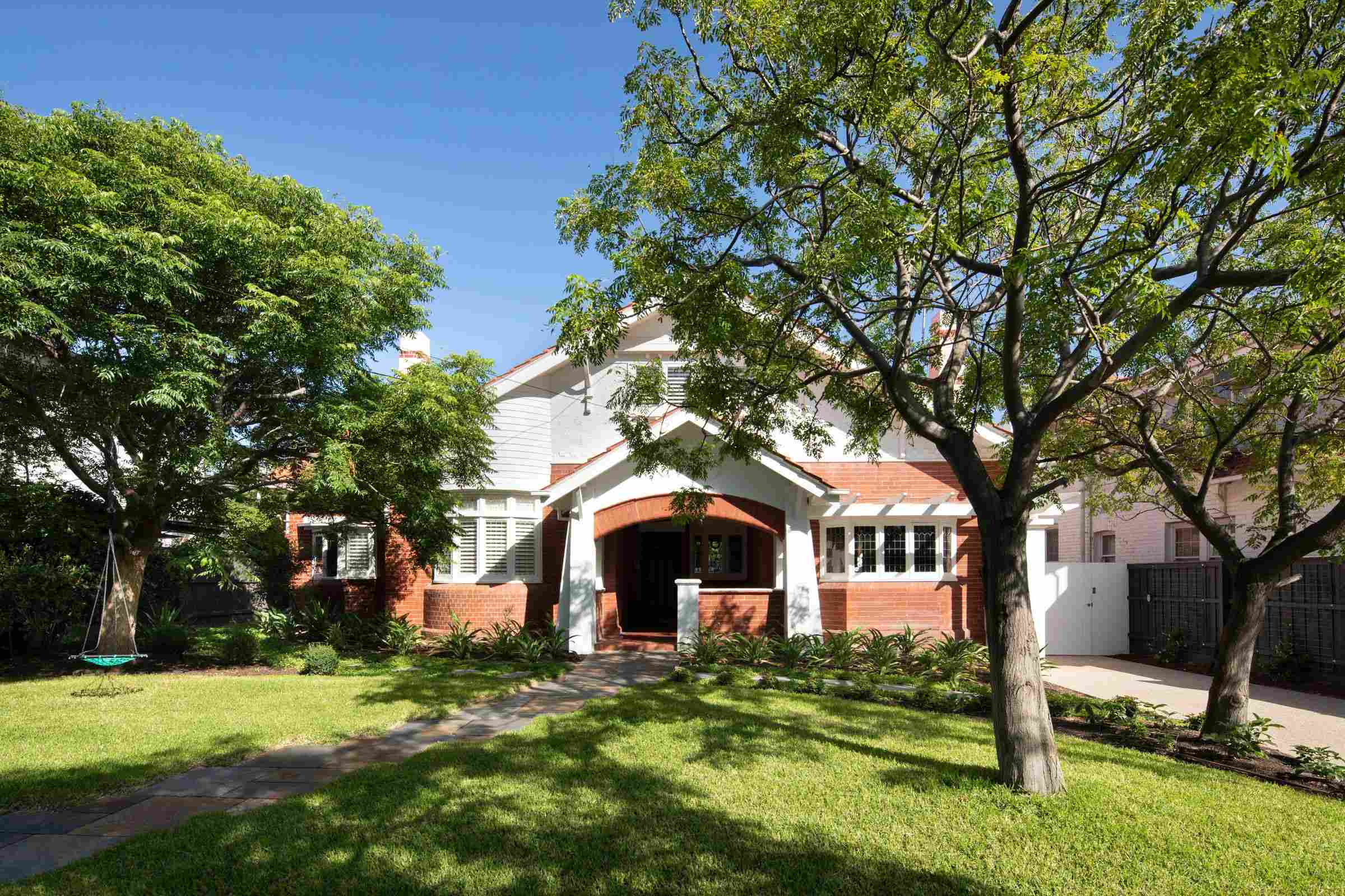 Elwood House by AM Architecture showing heritage street front in nice landscaped front yard