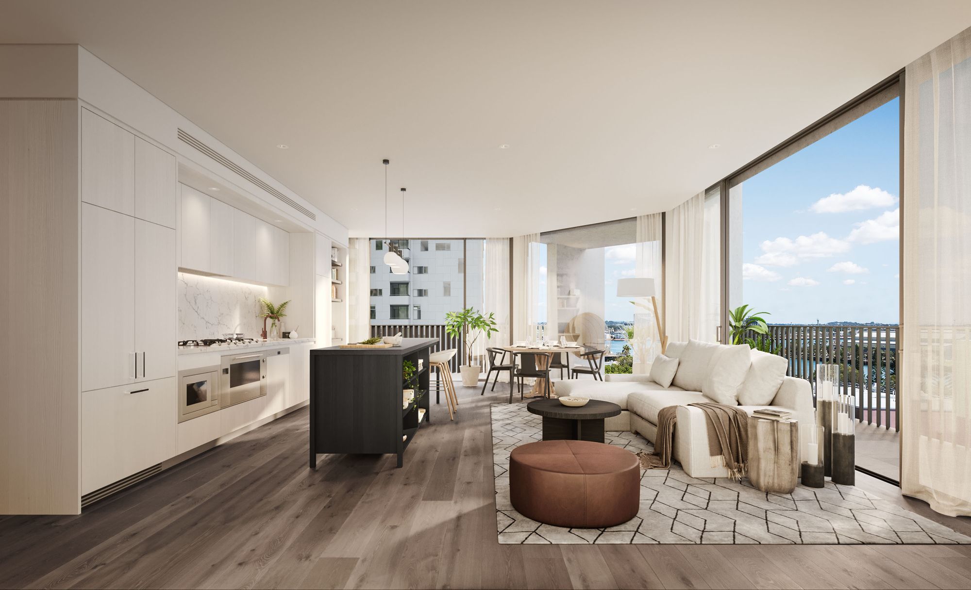  The image displays a luxurious, open-concept apartment interior. The modern kitchen is elegantly designed with white cabinetry, a marble backsplash, and a contrasting dark island. State-of-the-art appliances, including a built-in oven and cooktop, are seamlessly integrated. Beyond the kitchen, there's a dining area with a wooden table, surrounded by unique chairs. Adjacent to this is a comfortable living space, featuring a plush white sofa, a patterned rug, and a round ottoman. Contemporary decor items, like vases and a floor lamp, enhance the space. The apartment is well-lit with natural light streaming in from floor-to-ceiling windows, which also offer a panoramic view of the city and a bright blue sky with scattered clouds. The overall ambiance is serene and inviting, exuding a sense of high-end urban living.