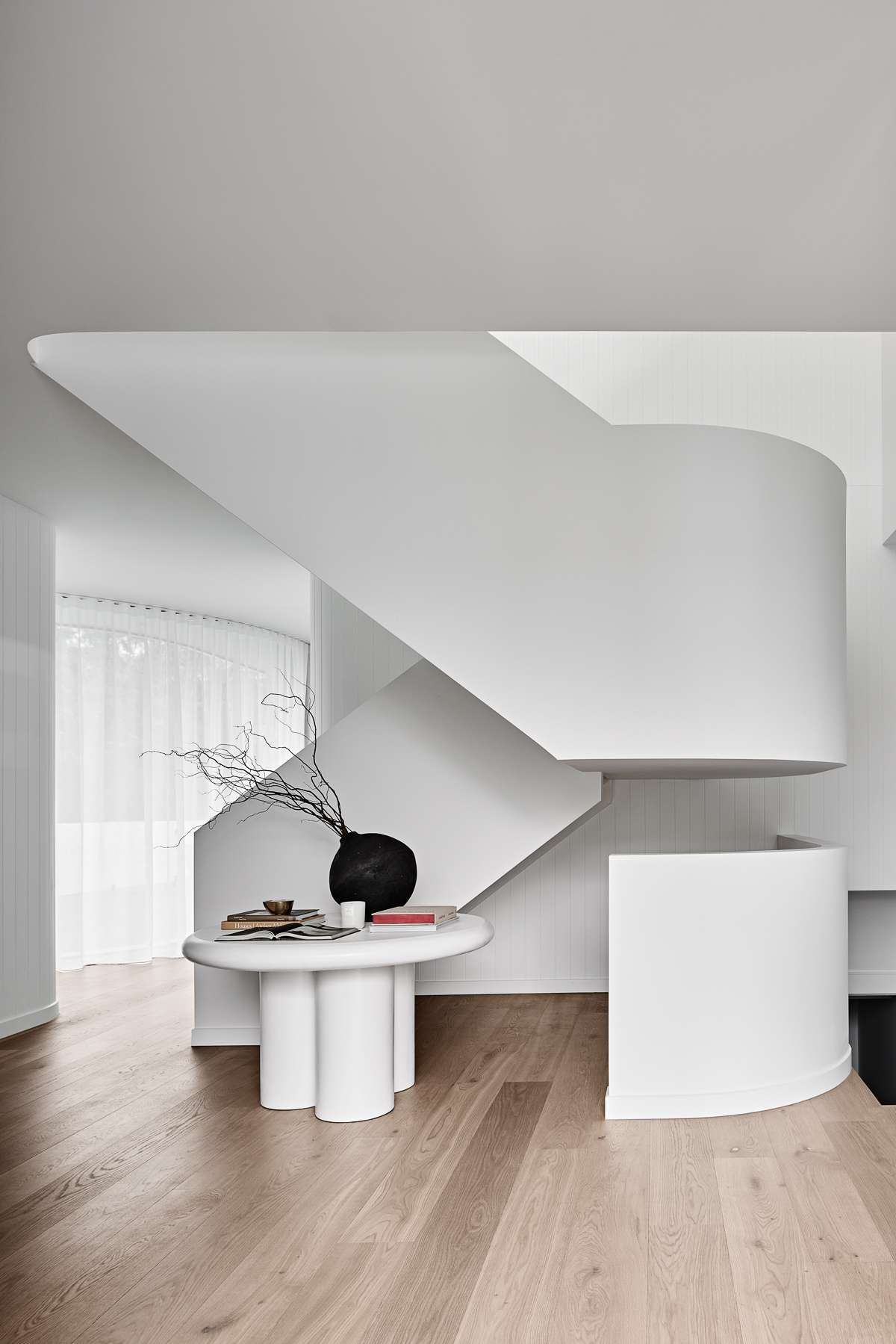 Amiri Courtyard House by Kelder Architects showing sculptural stair case