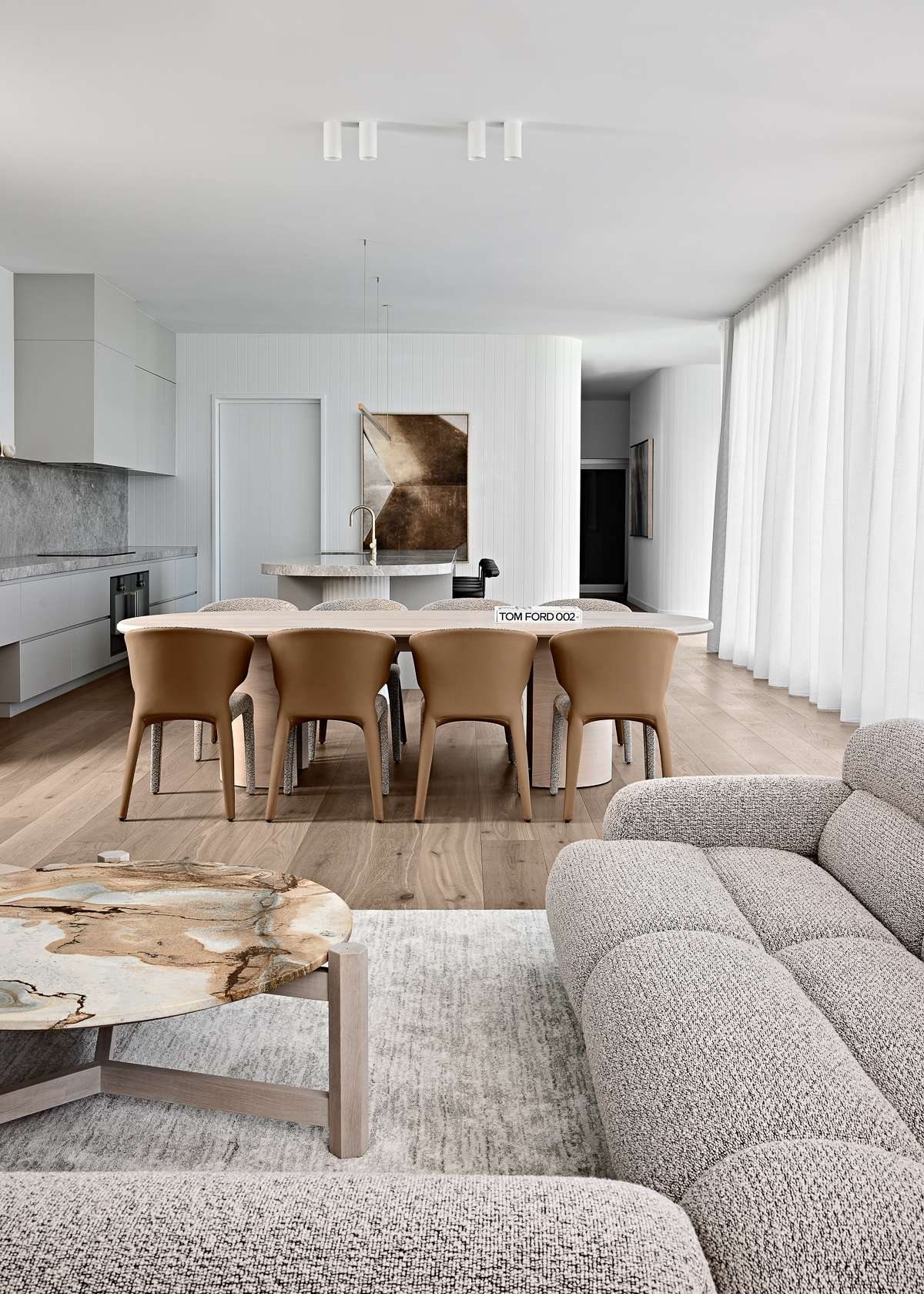 Amiri Courtyard House by Kelder Architects showing interior view of dining and living spaces