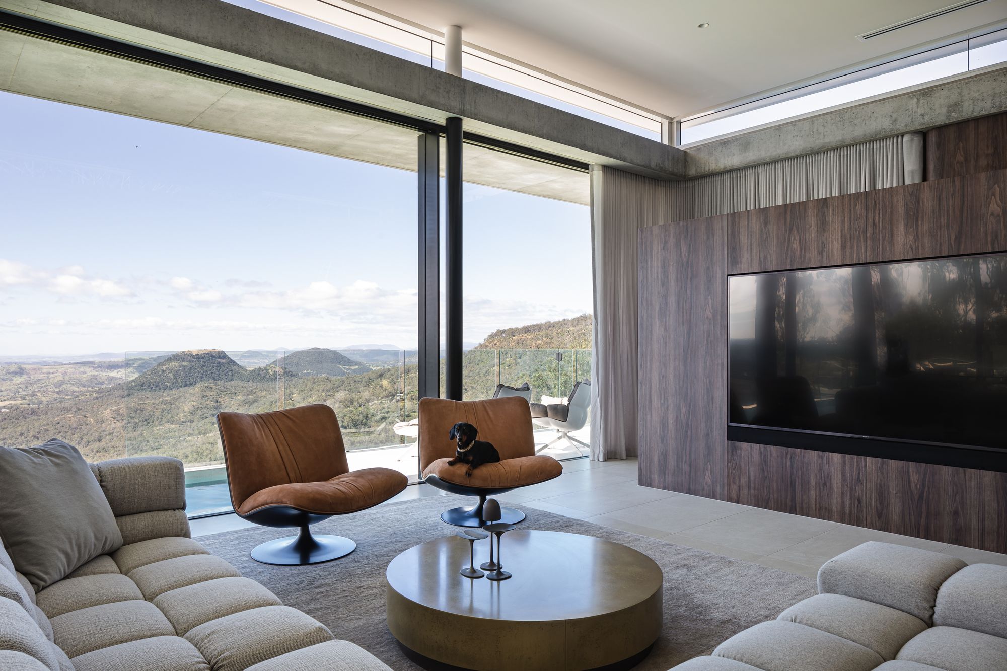Cliffhanger by Joe Adsett Architects showing an interior view of the living room and view beyond