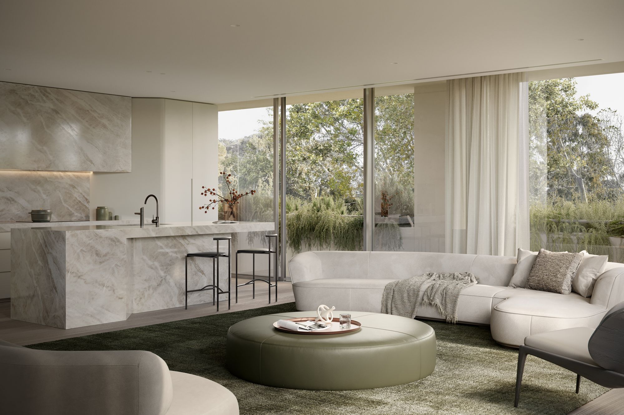 Como, Toorak by Prime Edition.Interior view of a stylish, modern living room with floor-to-ceiling windows that look out onto a natural landscape. The room features a large, circular, olive-green ottoman, a sleek, off-white sofa, and minimalistic decor. The space has a calm and luxurious atmosphere, with a neutral color palette and natural light filling the room.