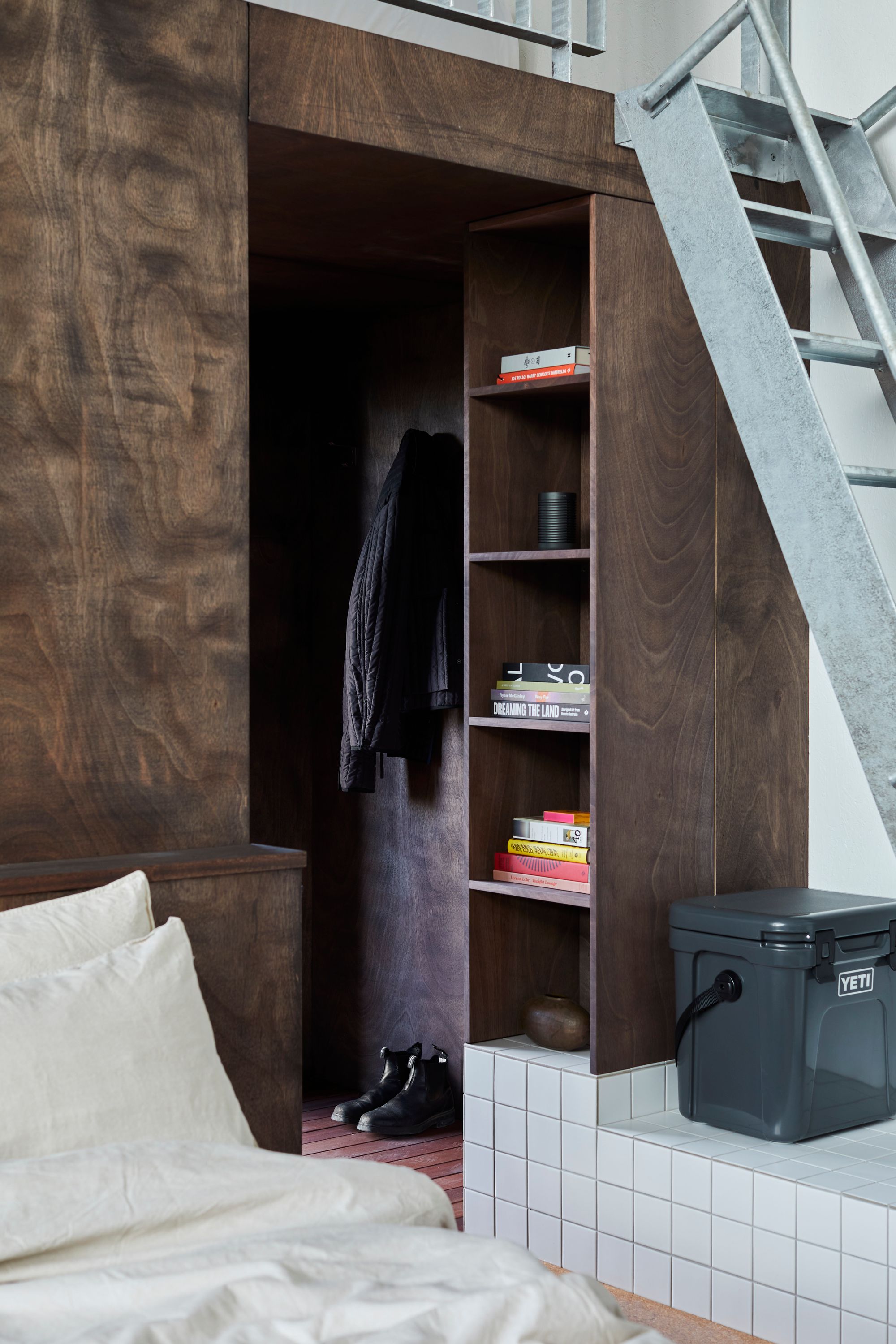 An interior view of the details at DEN PLACE showing the custom storage