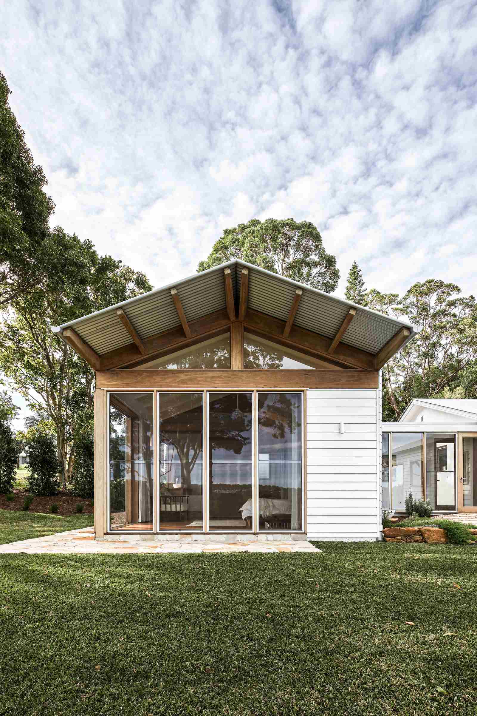 The Caretaker's by Aphora Architecture showing the external weatherboard walls of the house
