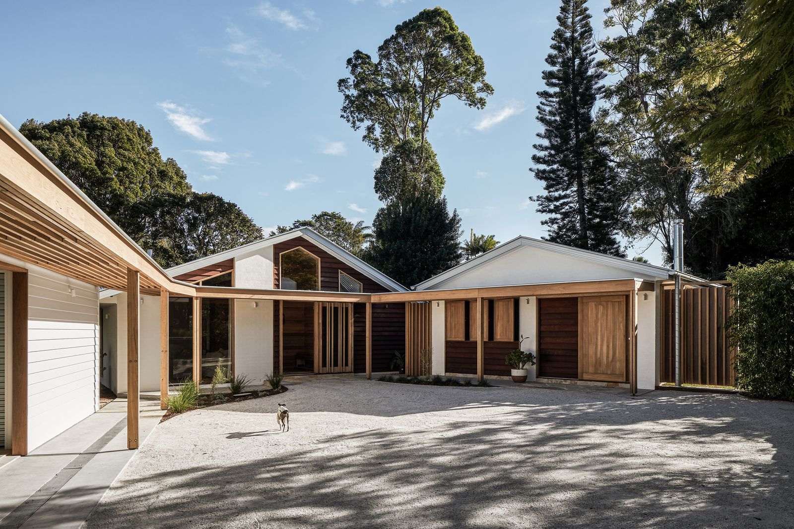 The Caretaker's by Aphora Architecture showing the entry courtyard to the house