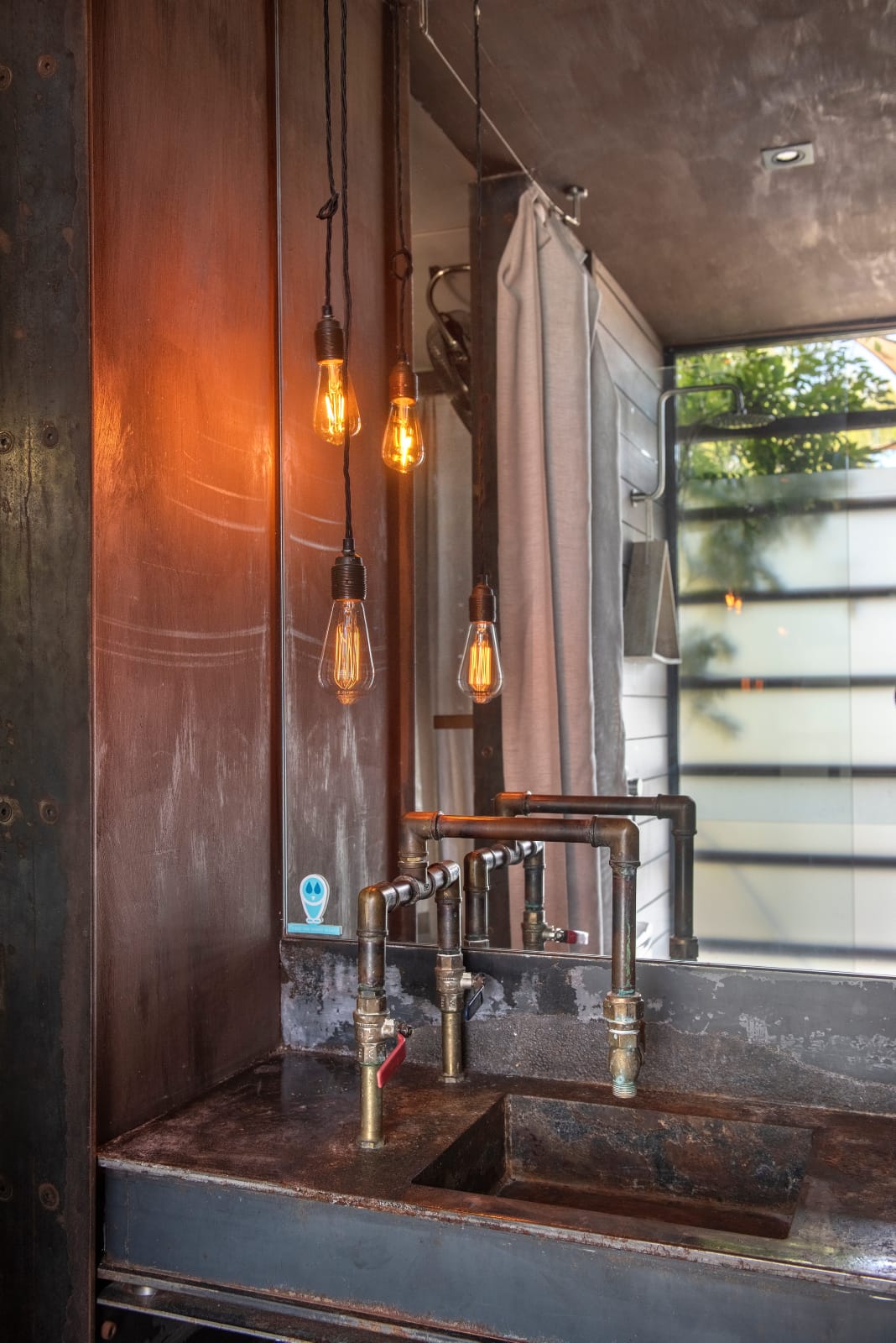 Bill's Boathouse. An interior view of the rustic and industrial style bathroom