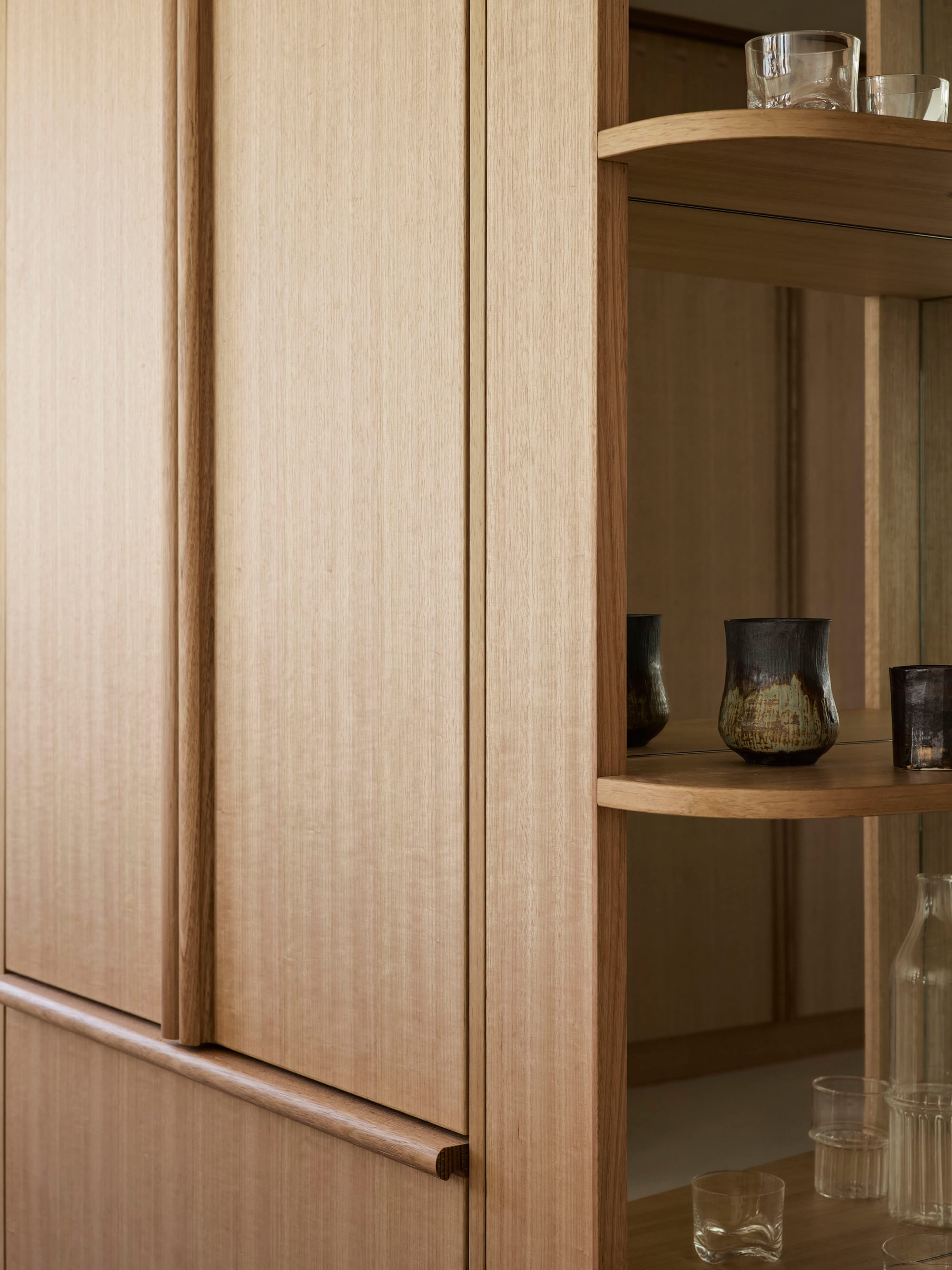 A detail shot of the Tasmanian timber veneer joinery in this modern apartment design by Studio ZAWA