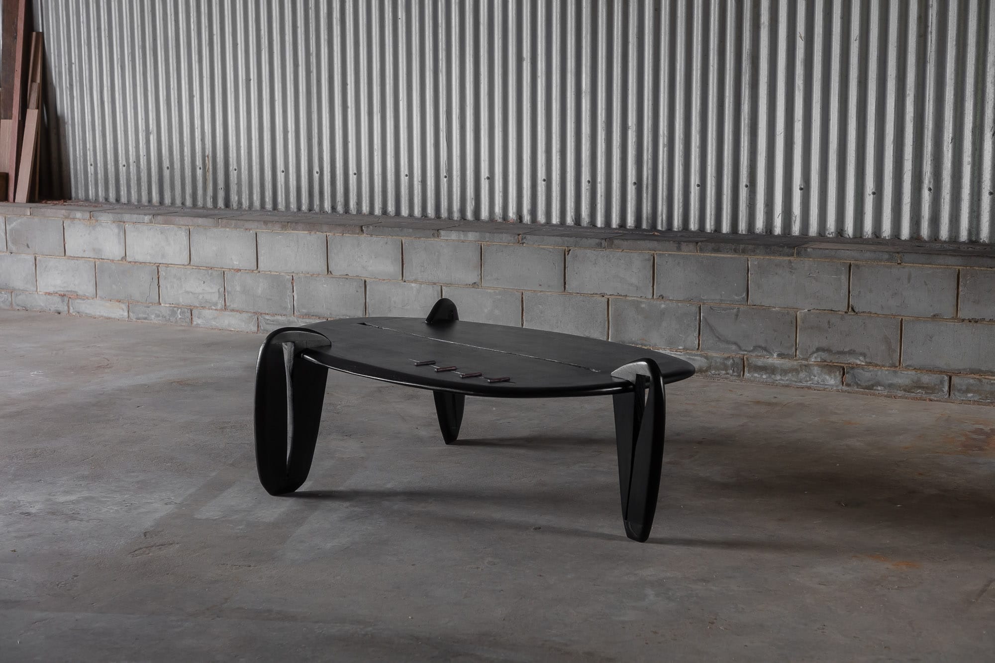 A styled shot in the warehouse of Two Blue Boys Furniture's black, unique coffee table