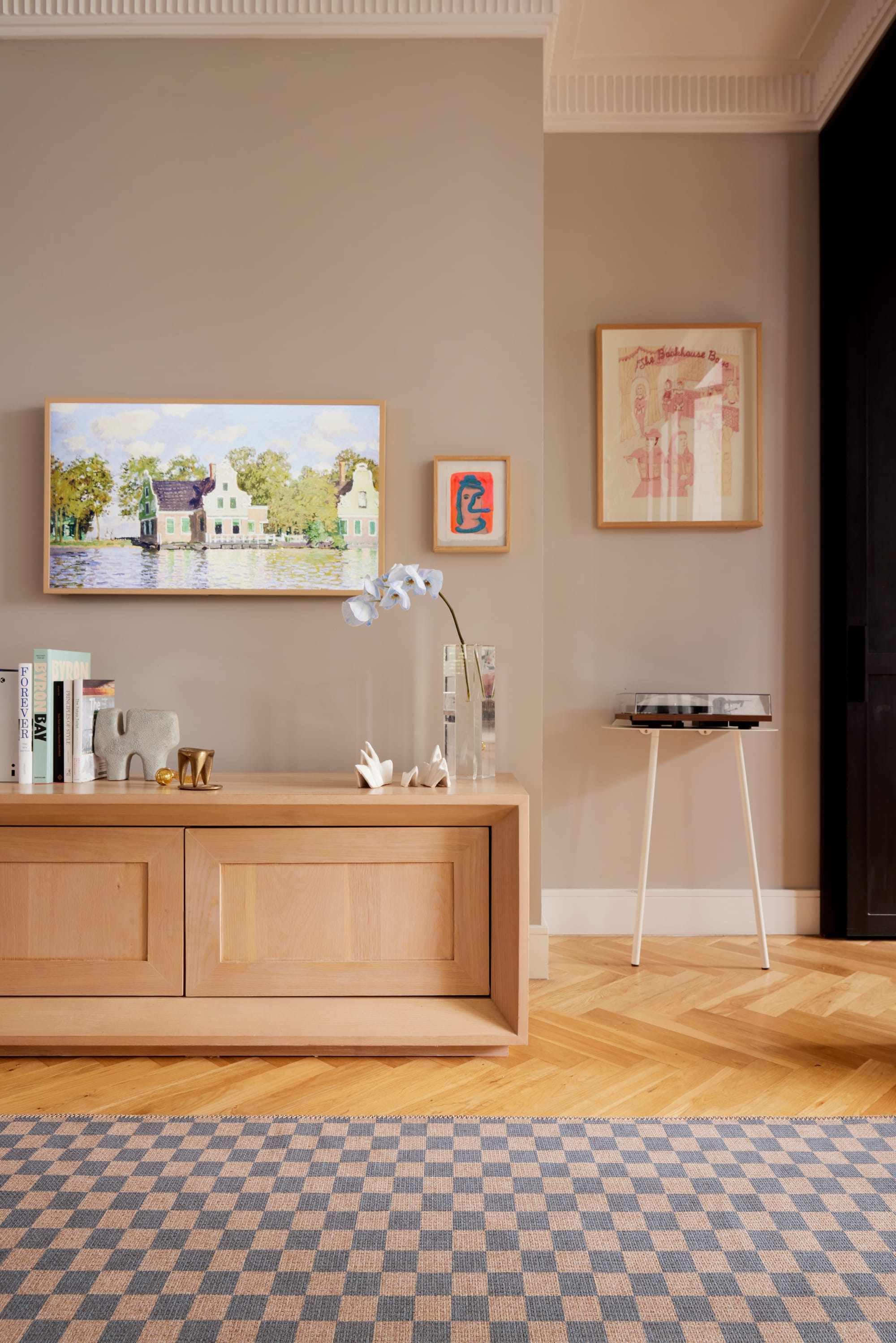 Checks Light Blue New Jute Rug by Double. Photographer: Jacqui Turk. Blue checkered hallway runner on timber herringbone floors, Timber sideboard and landscape artwork on wall.